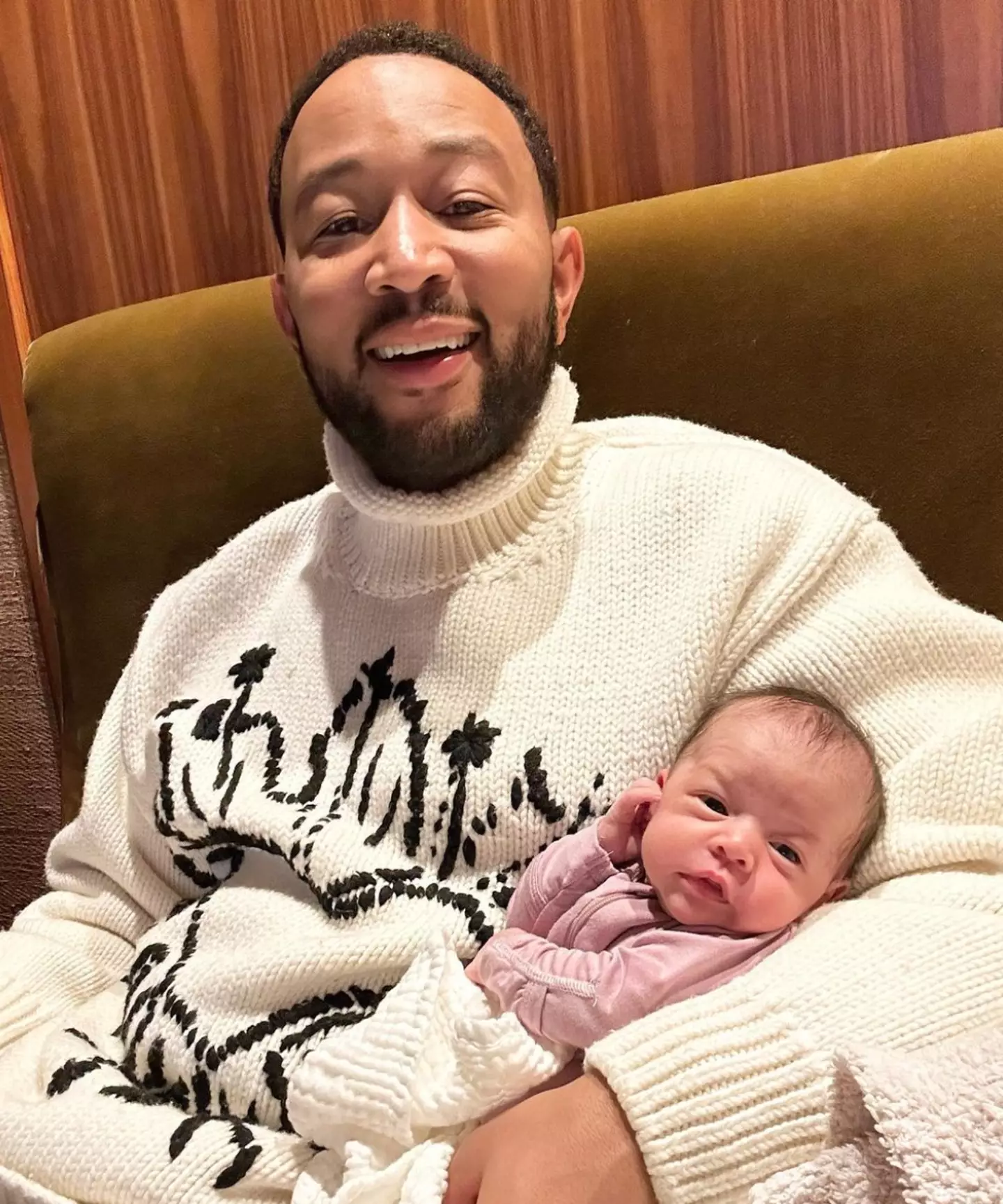 John Legend with his newborn daughter Esti.