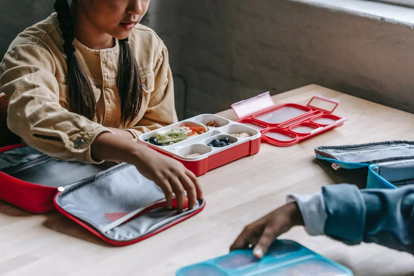 This school bust-up surrounds a lunch box.