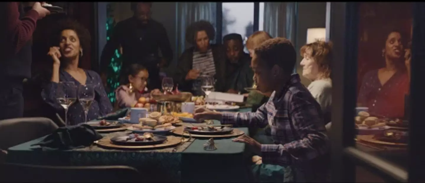 The advert features a Black family (