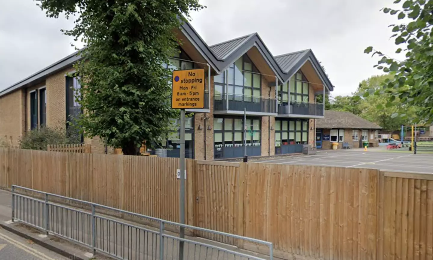 A car has collided with a school building in London.