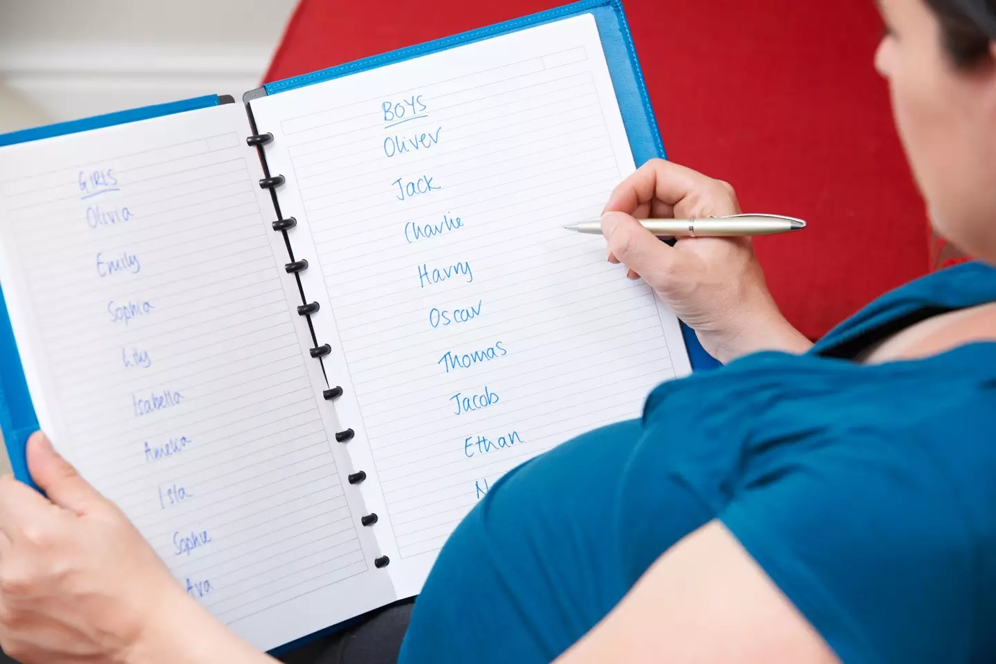A pregnant woman choosing baby names.