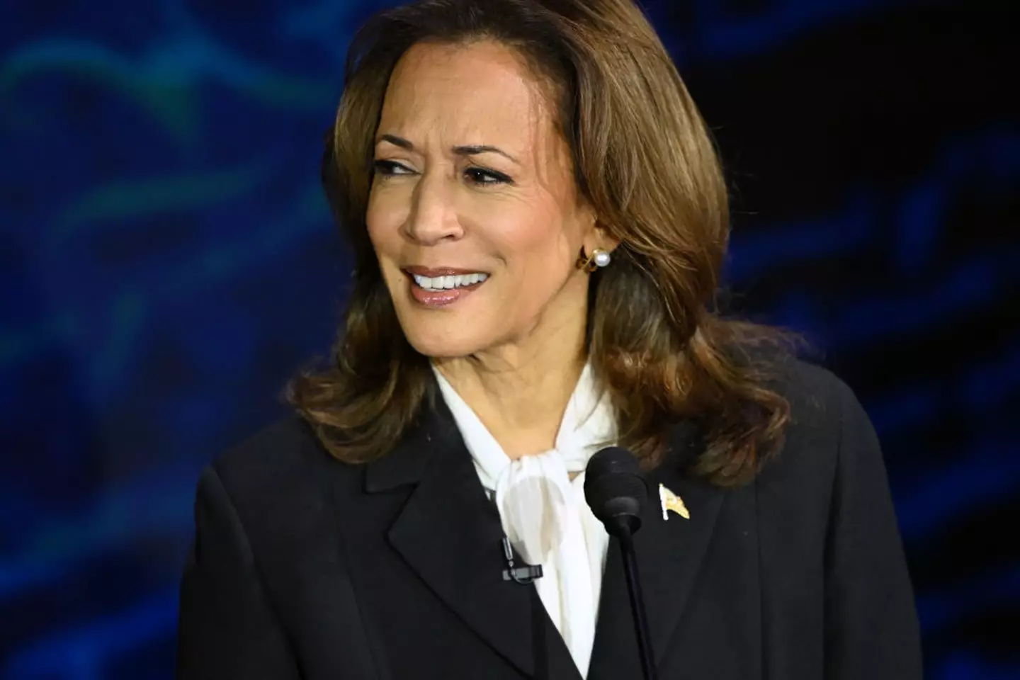 Kamala Harris is being accused of wearing an earpiece - though it is likely just pearl earrings (SAUL LOEB/AFP via Getty Images)