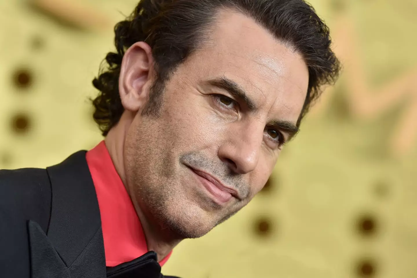 Borat star Sacha Baron Cohen has undergone a wild fitness transformation (Axelle/Bauer-Griffin/FilmMagic)