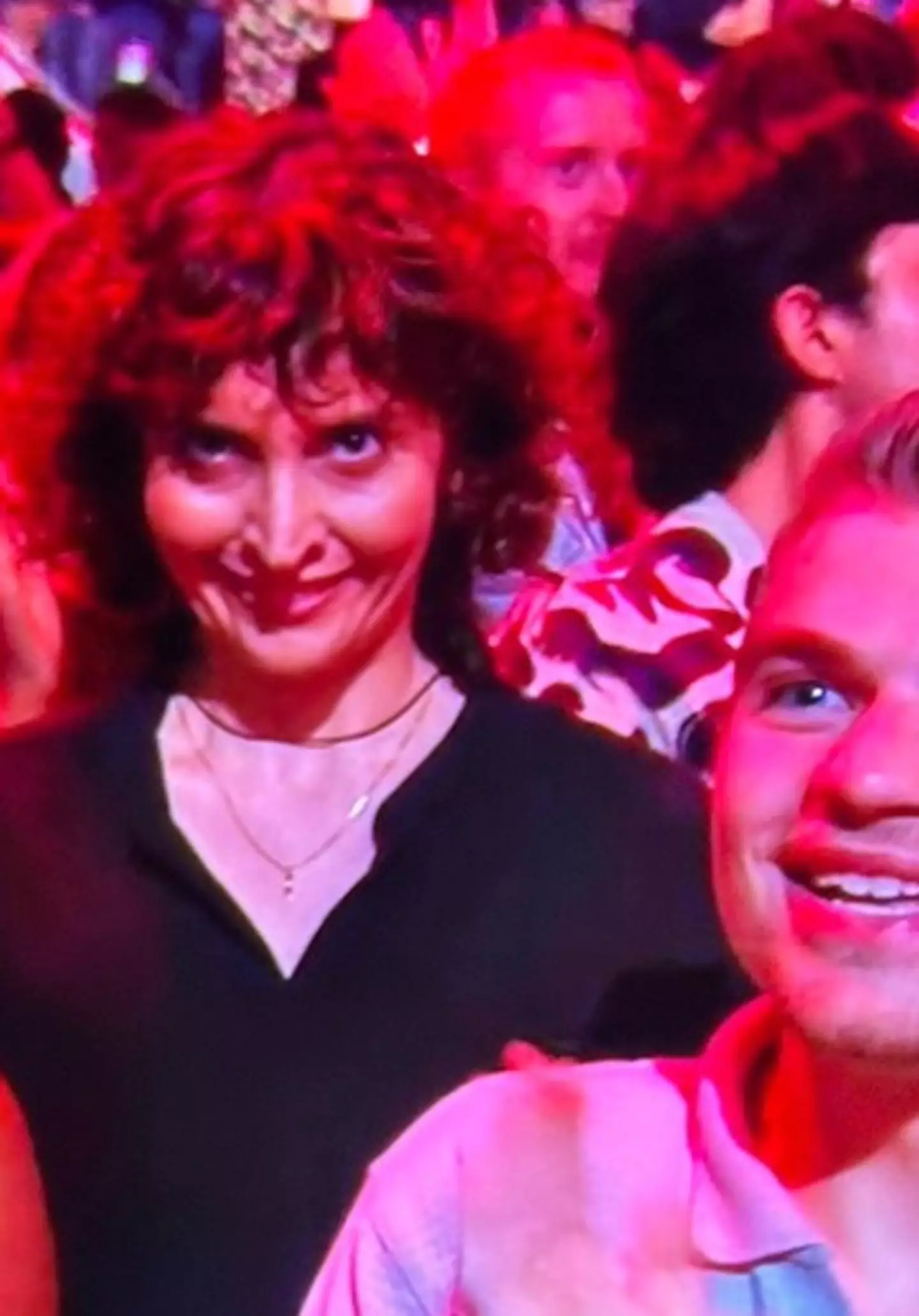 A woman smiling in the audience freaked out viewers (Twitter)