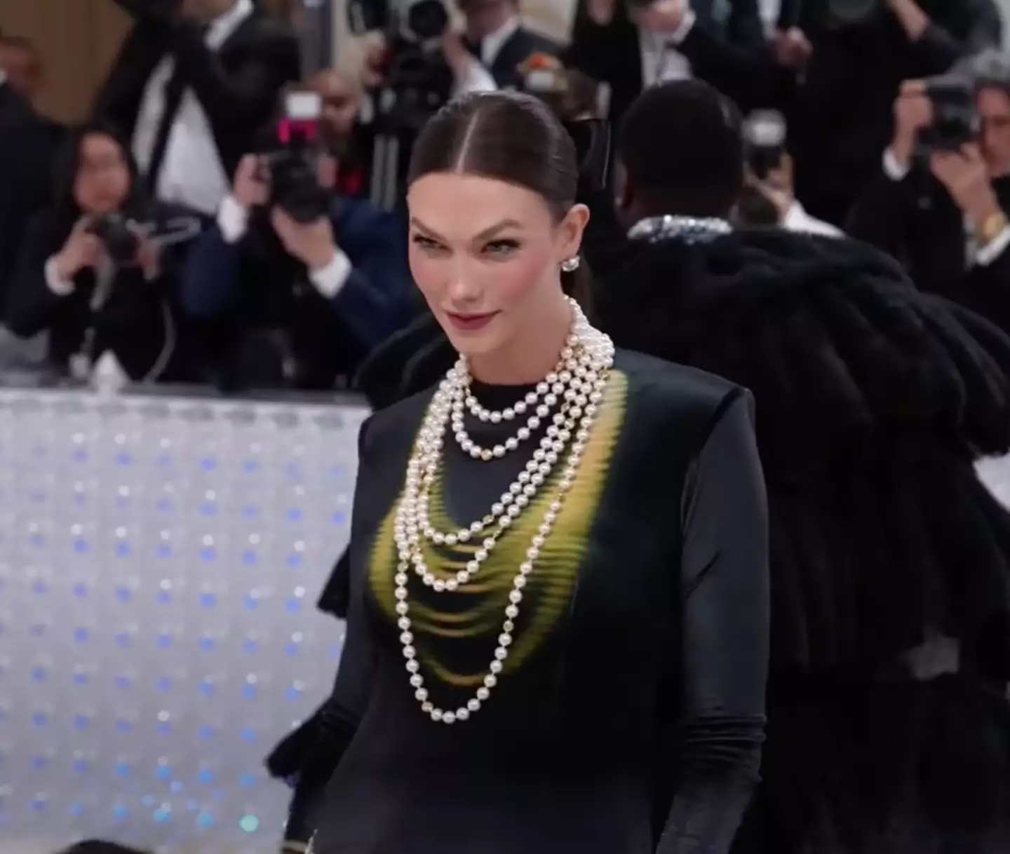 Model Karlie Kloss also showed off her growing bump at the Met Gala.