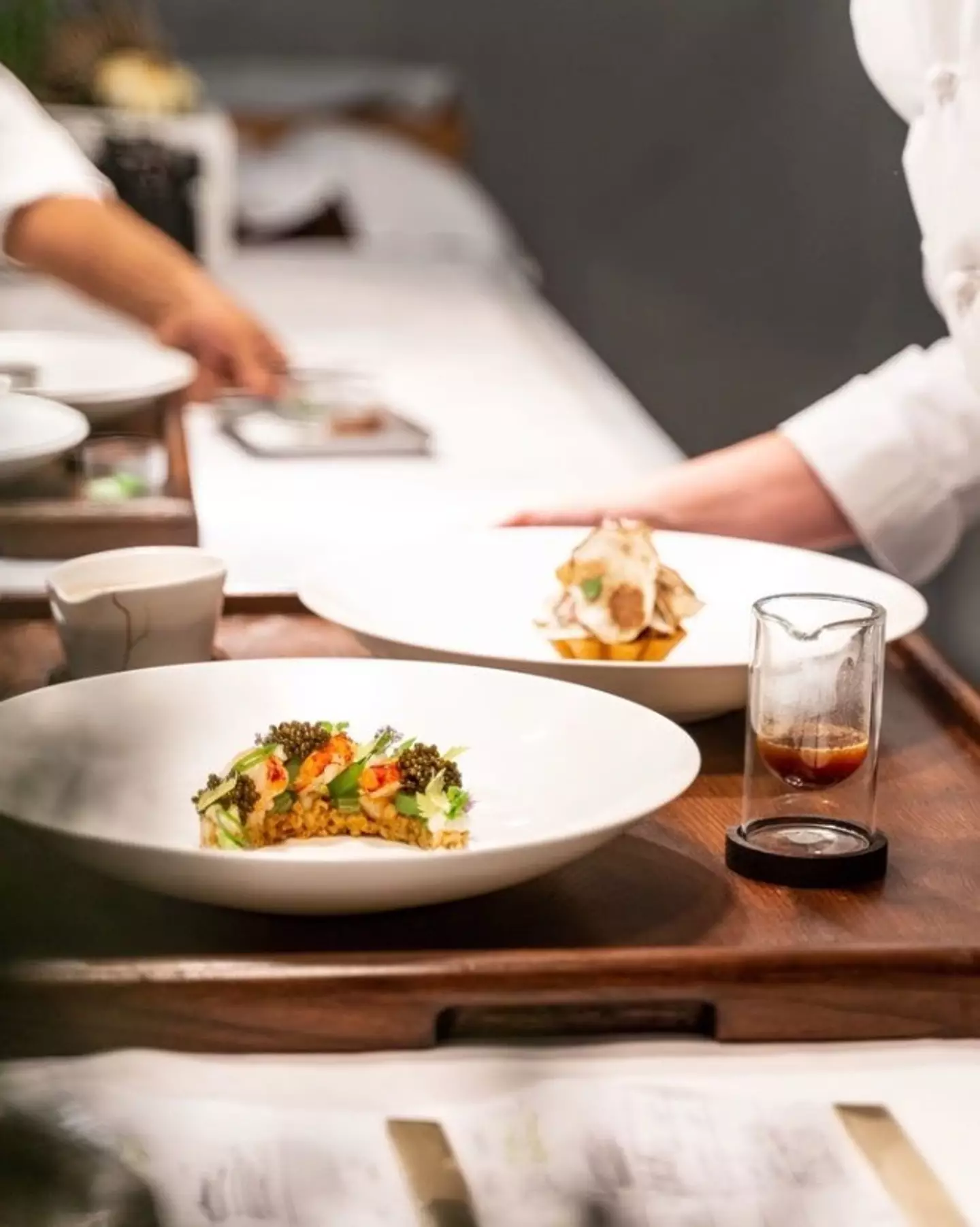 Her signature dishes include; langoustine with caviar, roasted squab with foie gras, and chocolate soufflé with hazelnut ice cream.