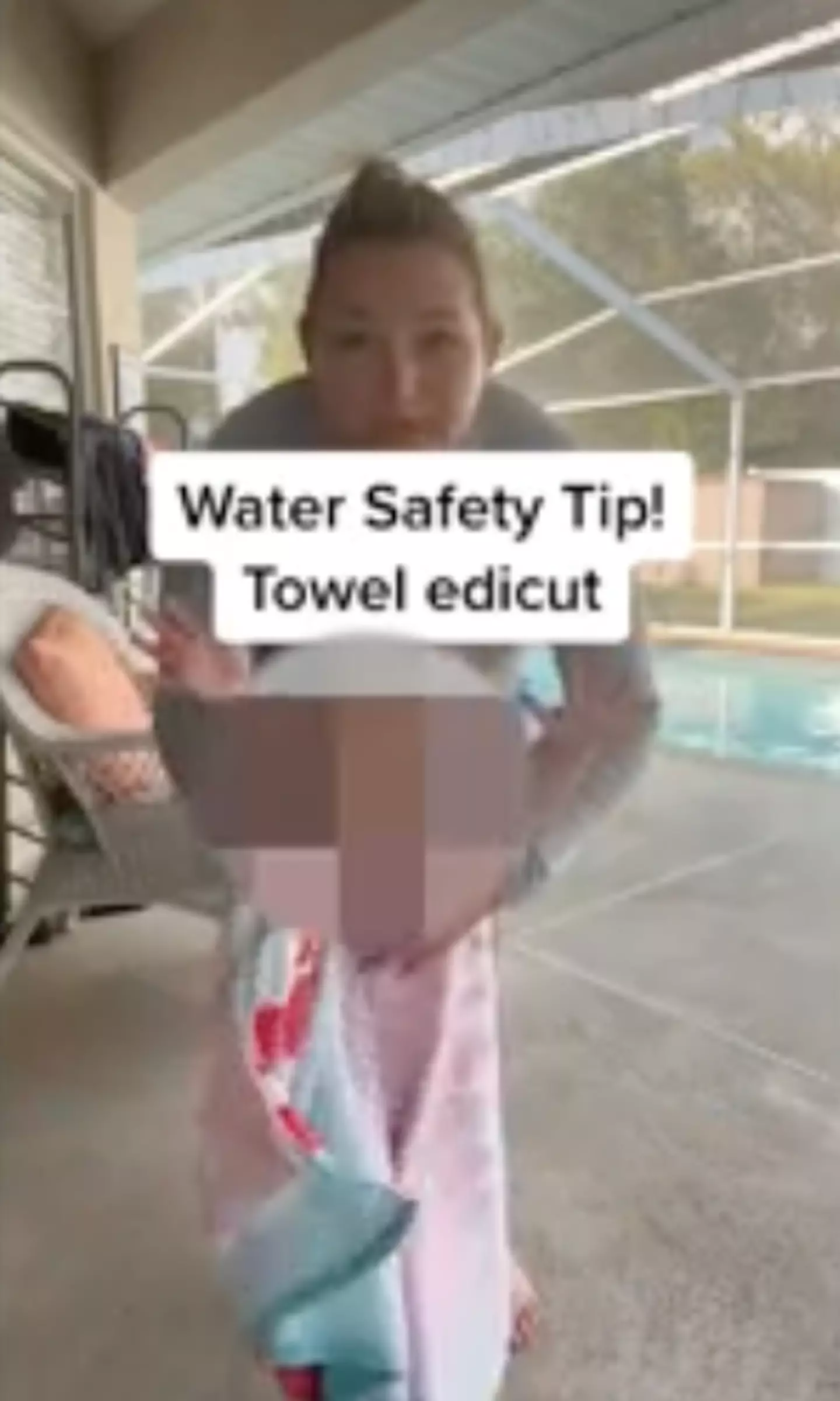 It's safer to put the towel underneath the child's arms.