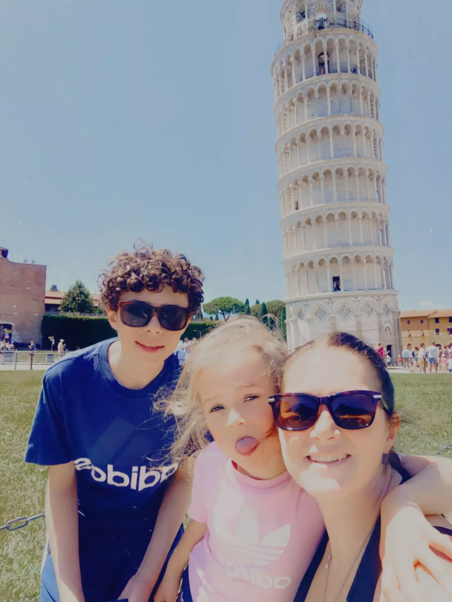 Roxanne and her two kids in Pisa.