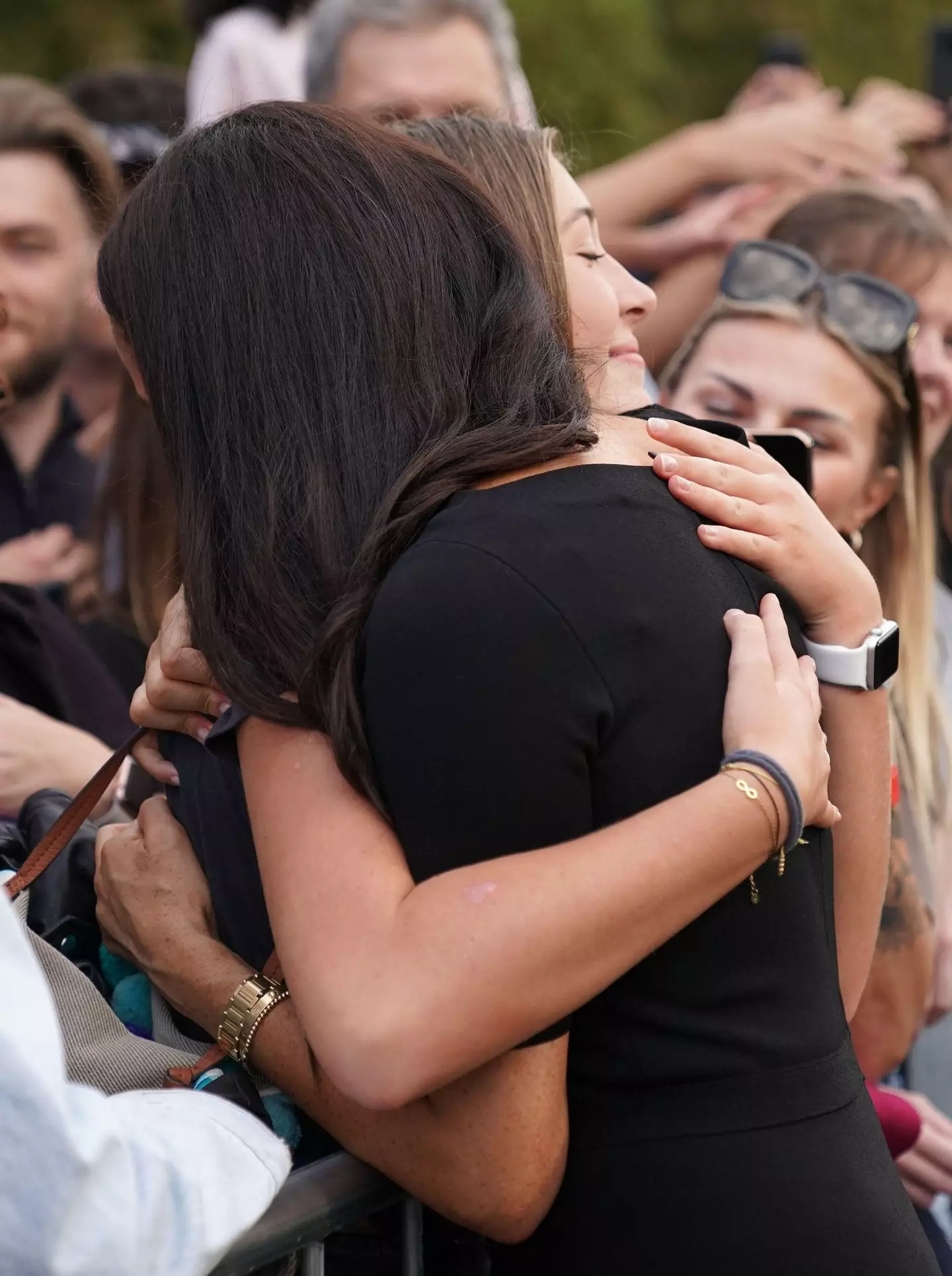 Meghan Markle hugged a young mourner outside Windsor Castle.