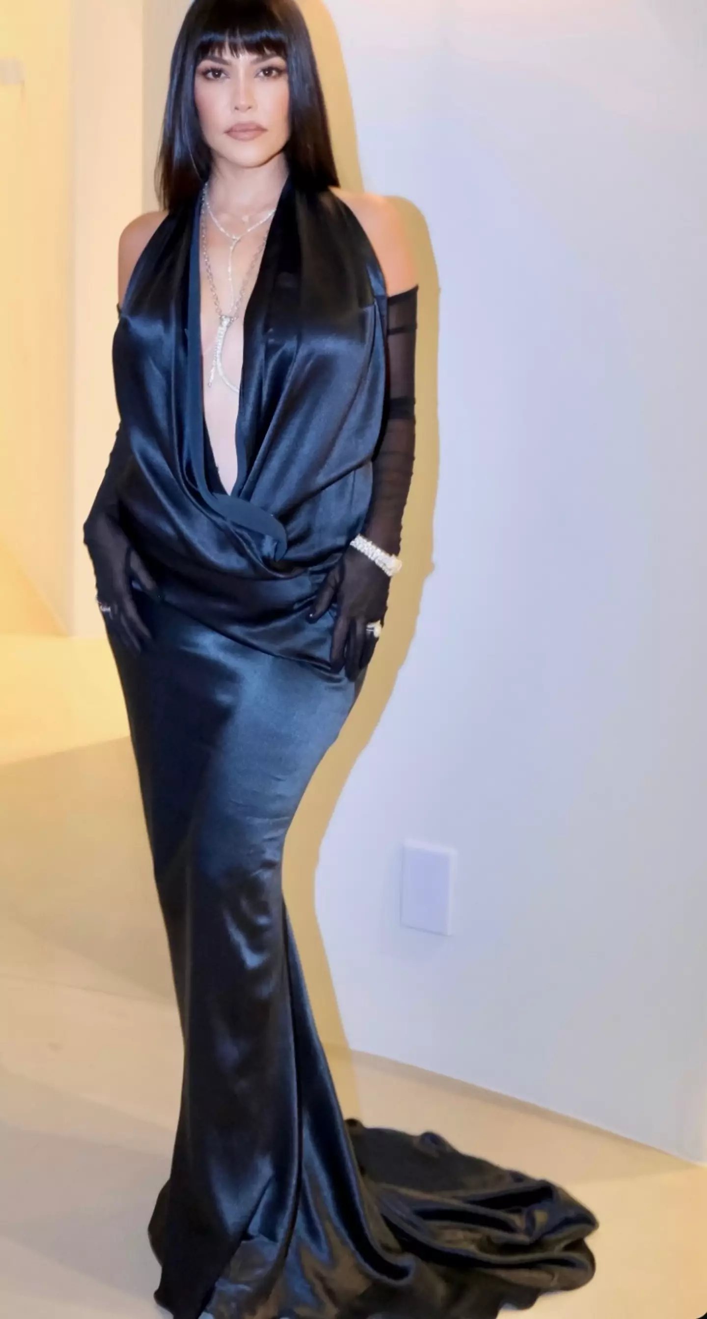 Kourtney wowed in a floor-length black gown for her mum's big night (Instagram/@kourtneykardash)