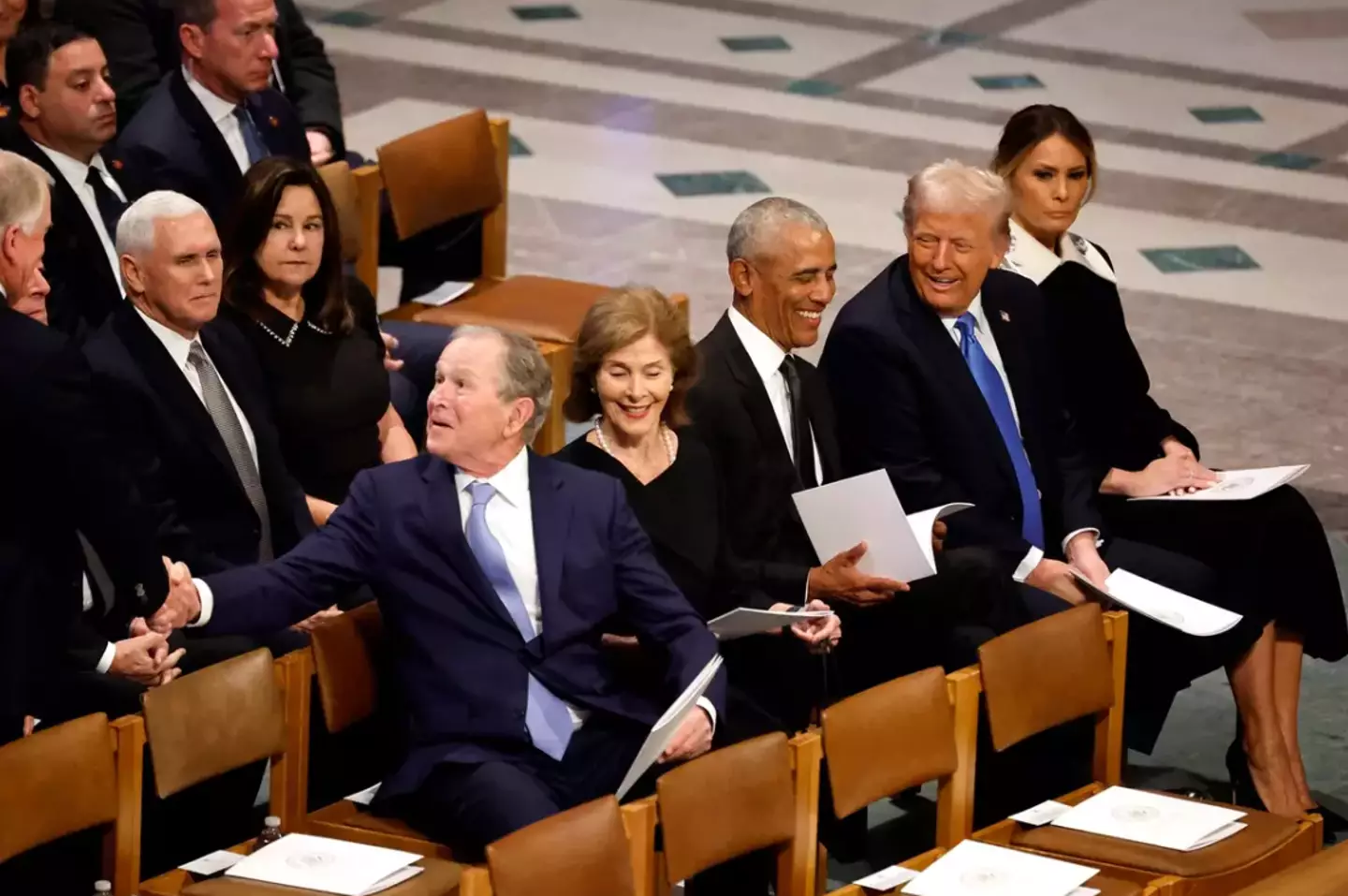 What Trump and Obama were talking about in the viral moment has seemingly been revealed (Chip Somodevilla/Getty Images)