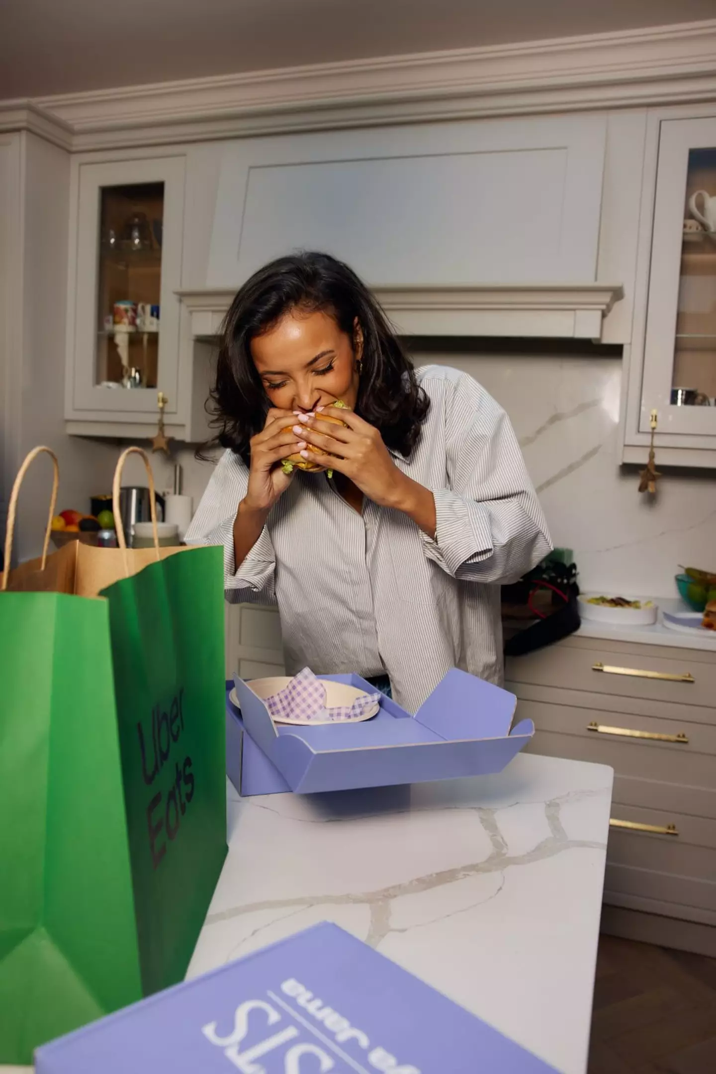 Maya eats a delicious burger from her new menu - which she says is an all-rounder meal and the best cure of comfort food