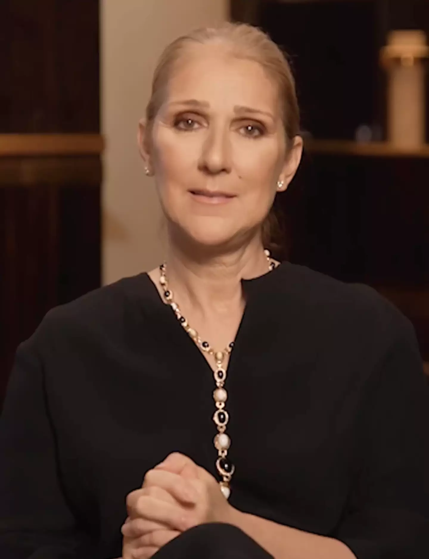 Dion also shared a video with her fans to explain the initial postponement.