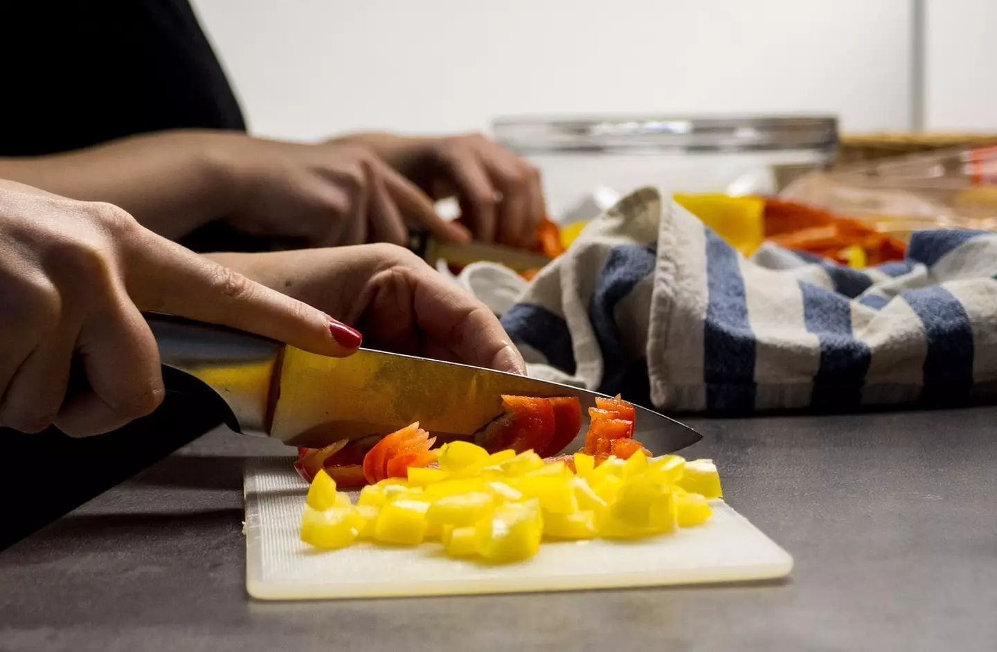 The woman said she found it difficult to start cooking with her kids hanging off her.