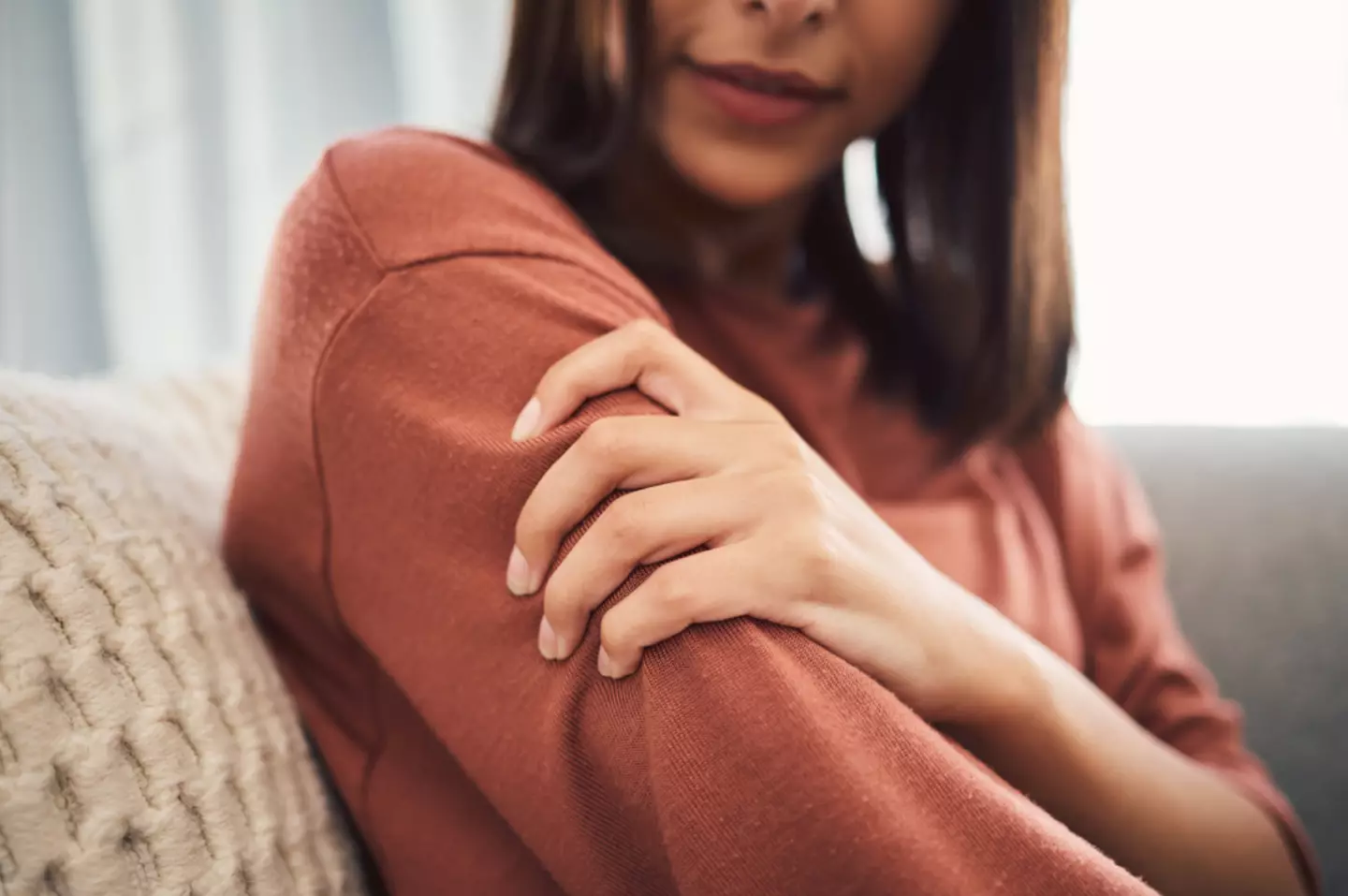 Arm pain is also a key indicator of the health ailment. (PeopleImages/Getty)