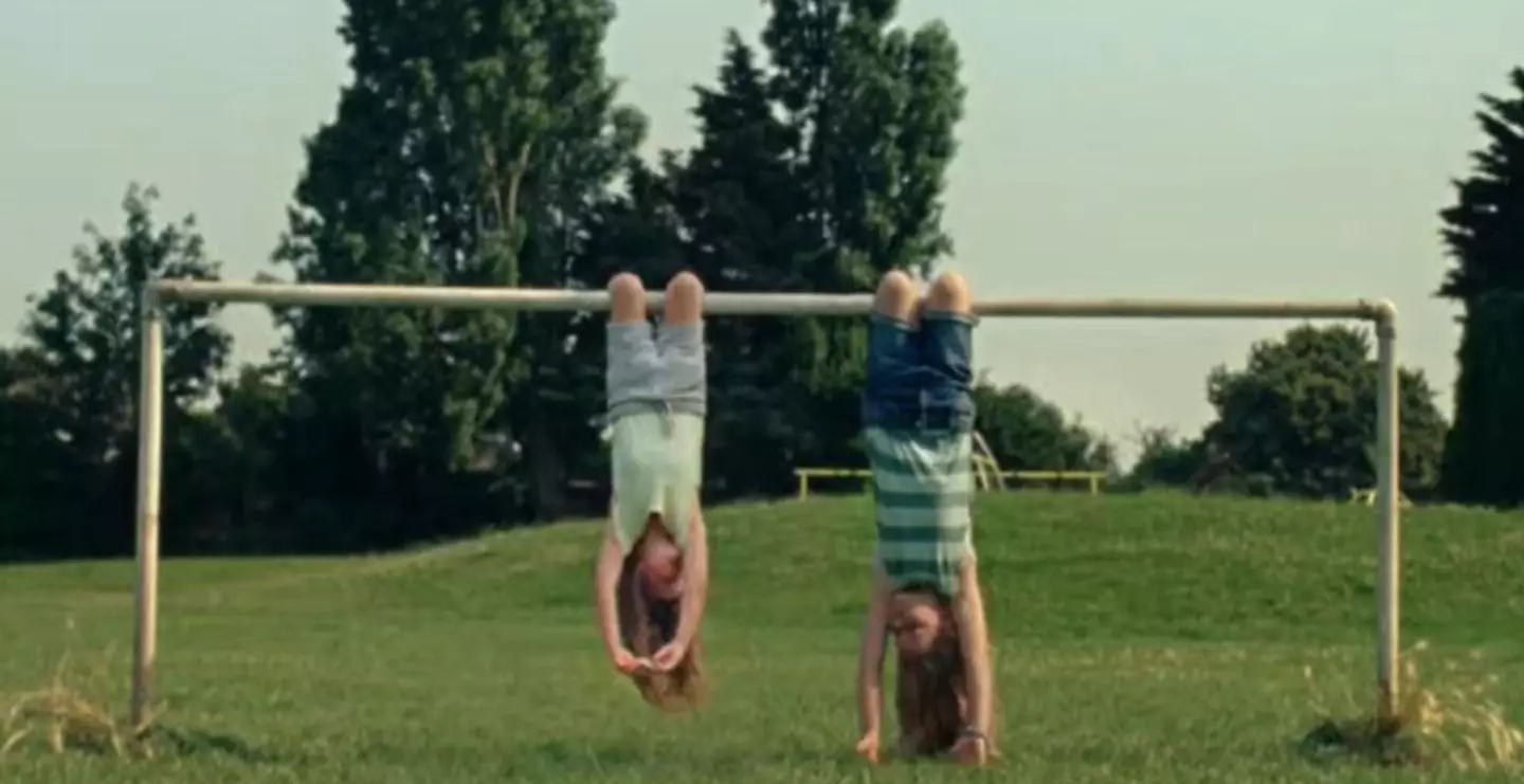 The advert featured two girls hanging upside down (