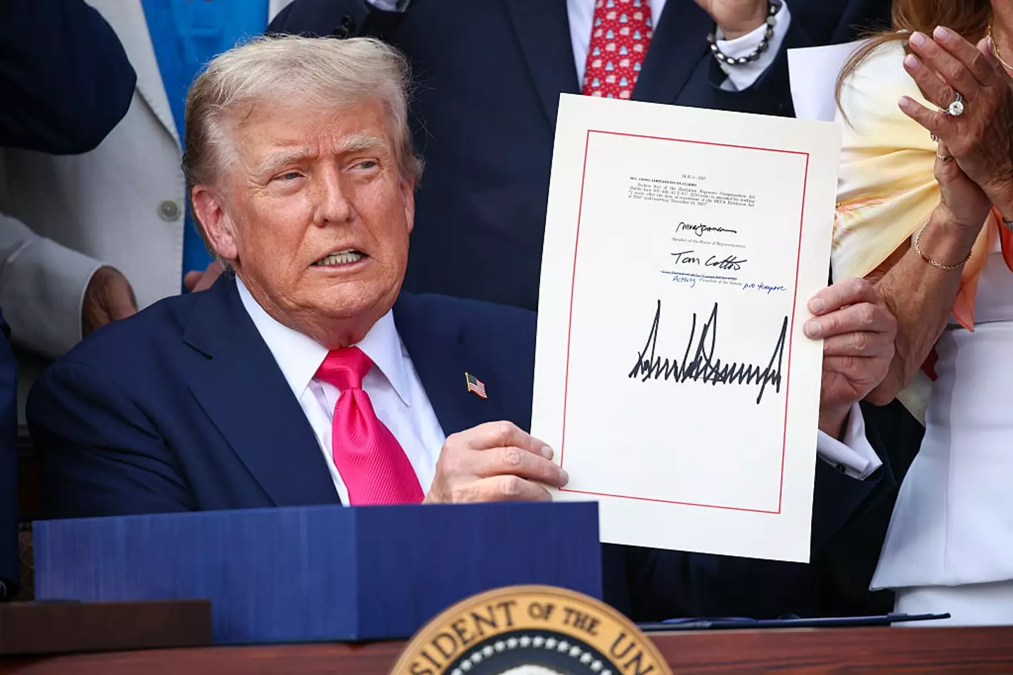 Trump signed the bill on 4 July (Samuel Corum/Getty Images)