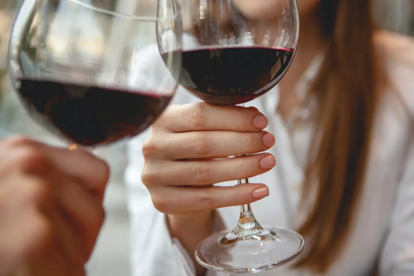 Steer clear of sweaty palms when holding a glass of wine. (webphotographeer / Getty Images)