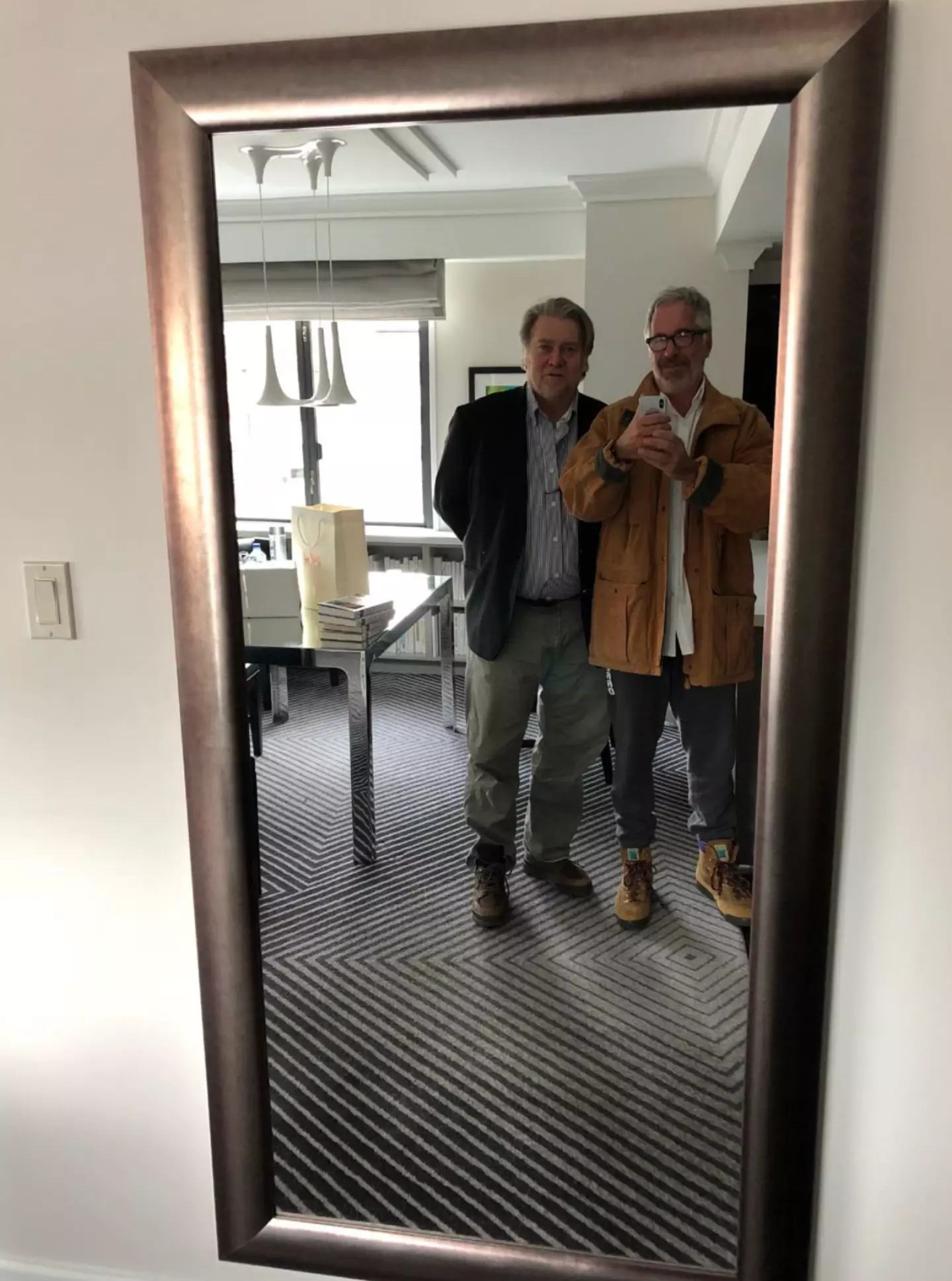 Another photo shows former Trump adviser Bannon posing with Epstein (House Oversight Committee)