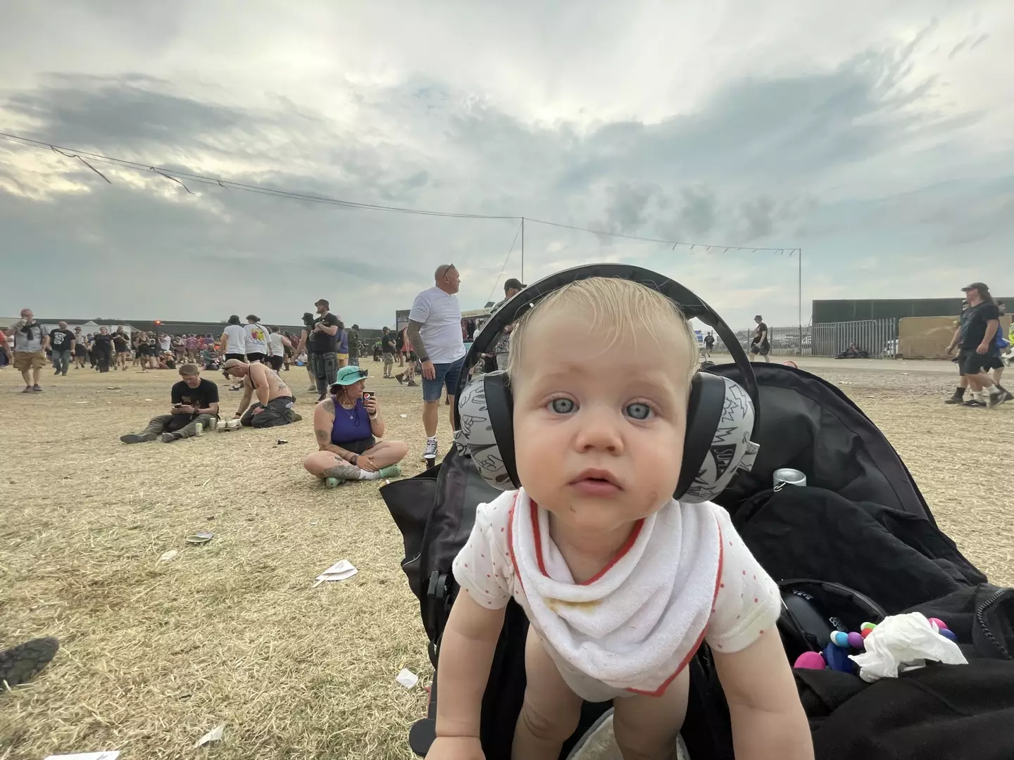 Baby Lemmy wore headphones at the festival.