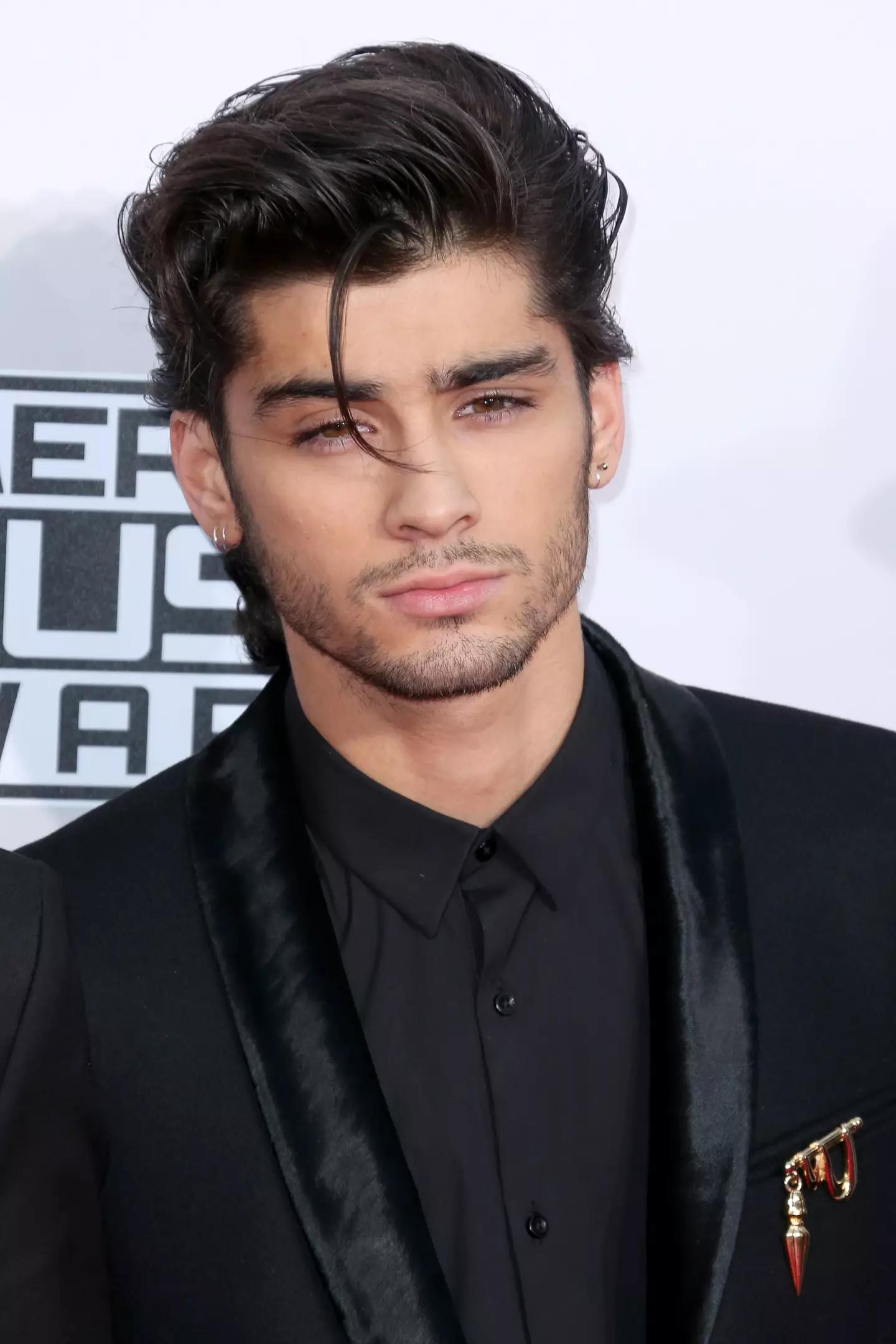 Zayn Malik has reportedly been 'charged' with harassment (