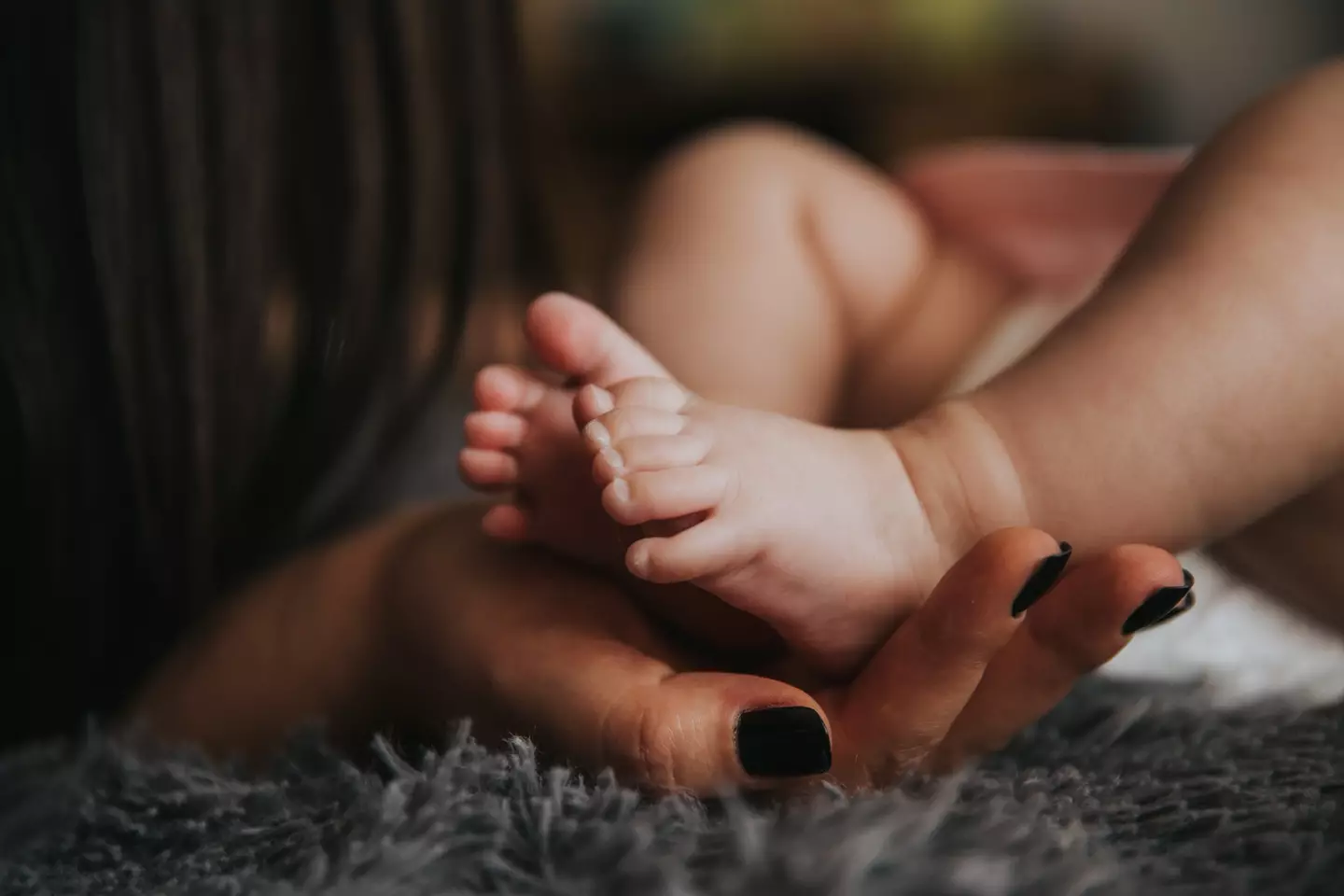 Baby Noah fell from his mum's bed onto blankets and pillows on the floor.