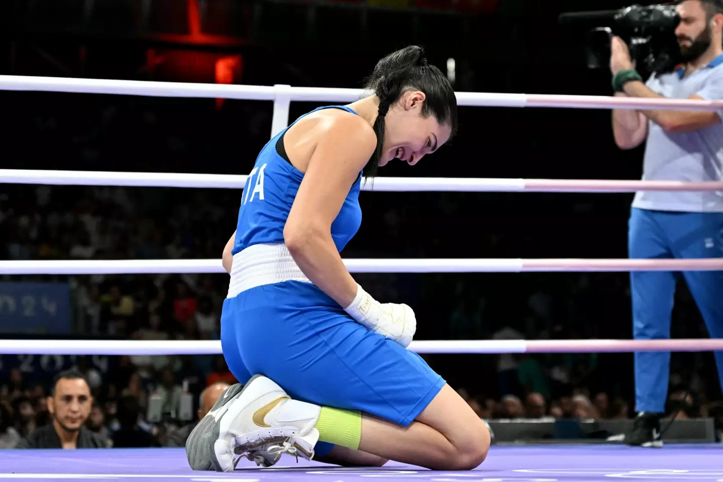 Italy's Angela Carini broke down in tears on the canvas after calling off the bout (MOHD RASFAN/AFP via Getty Images)
