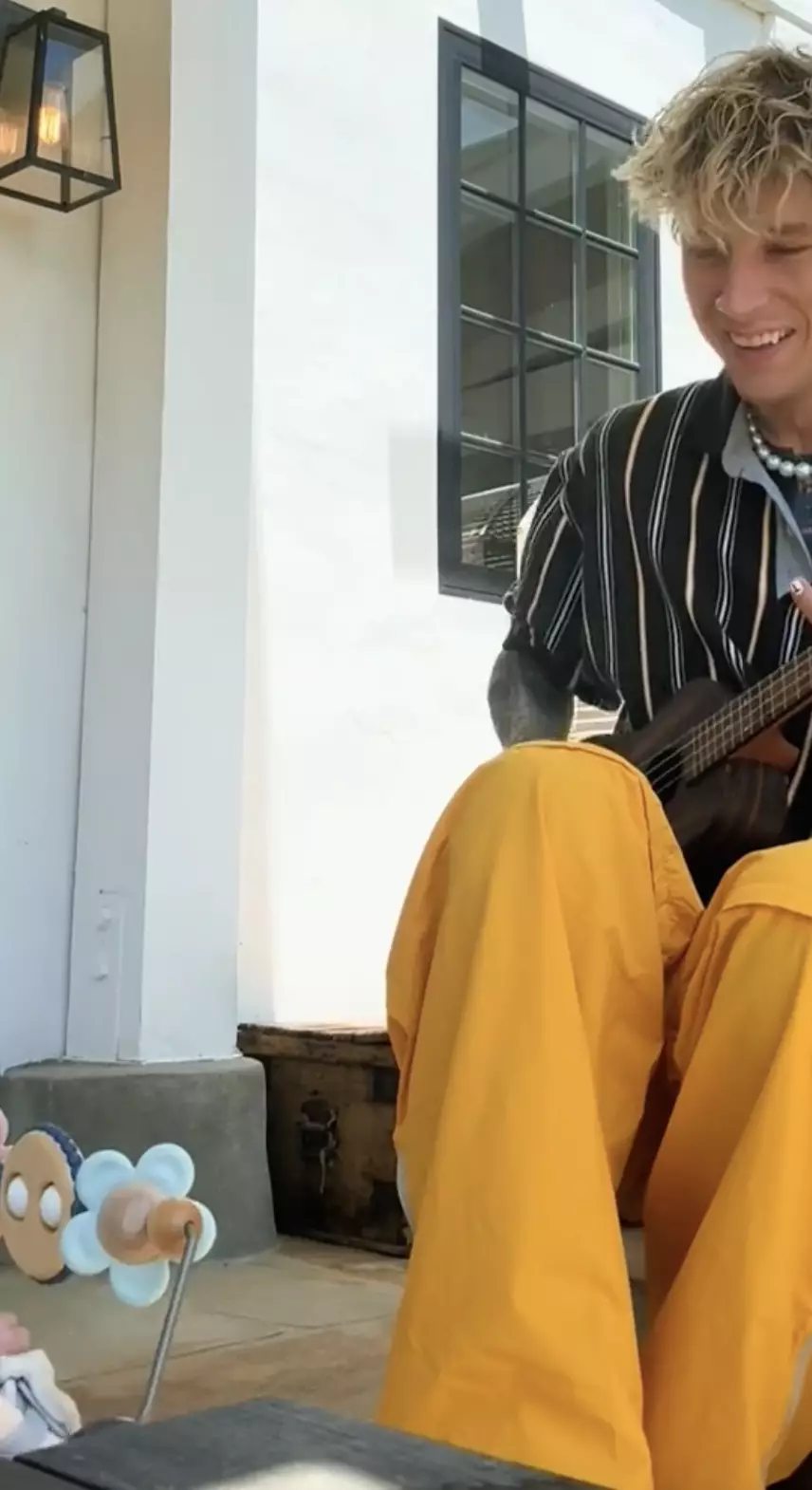 MGK can be seen playing the ukulele in the video (Instagram/@machinegunkelly)