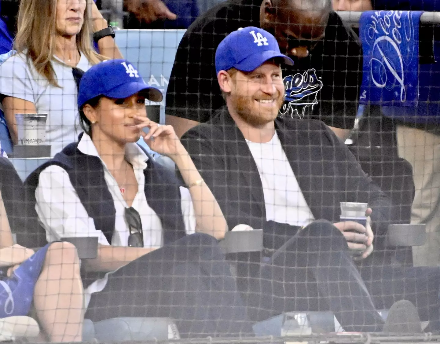 Prince Harry and Meghan Markle sat front row during the LA Dodgers and Toronto Blue Jays game on Tuesday (28 October) (Keith Birmingham/MediaNews Group/Pasadena Star-News via Getty Images)
