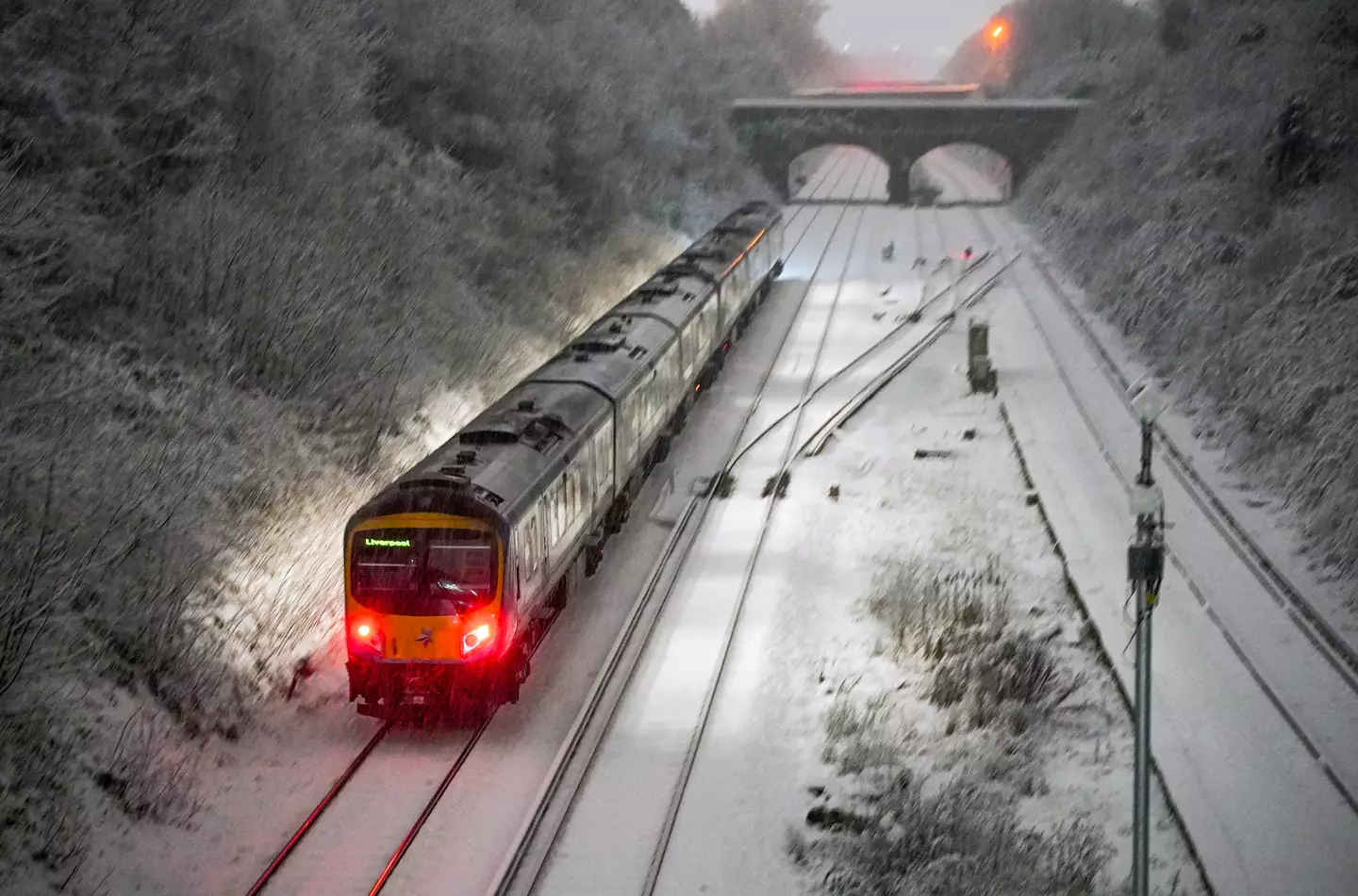 Snow falls at Hunt Cross station, Liverpool.