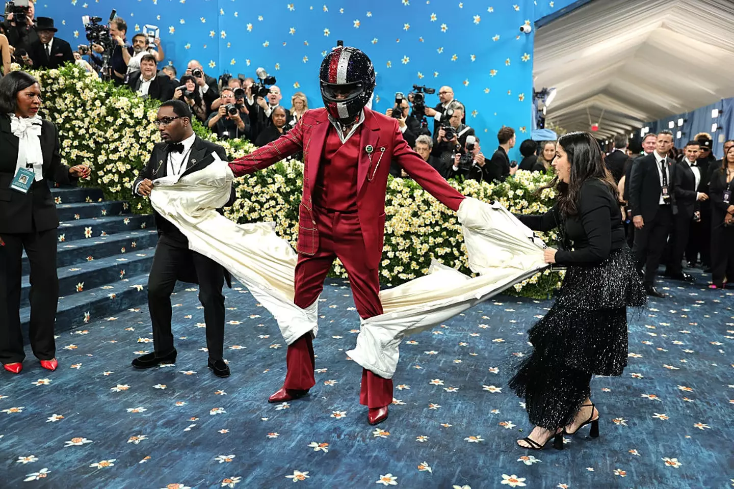 His race suit appears to be a nod to his upcoming movie, F1 (Dia Dipasupil/Getty Images)