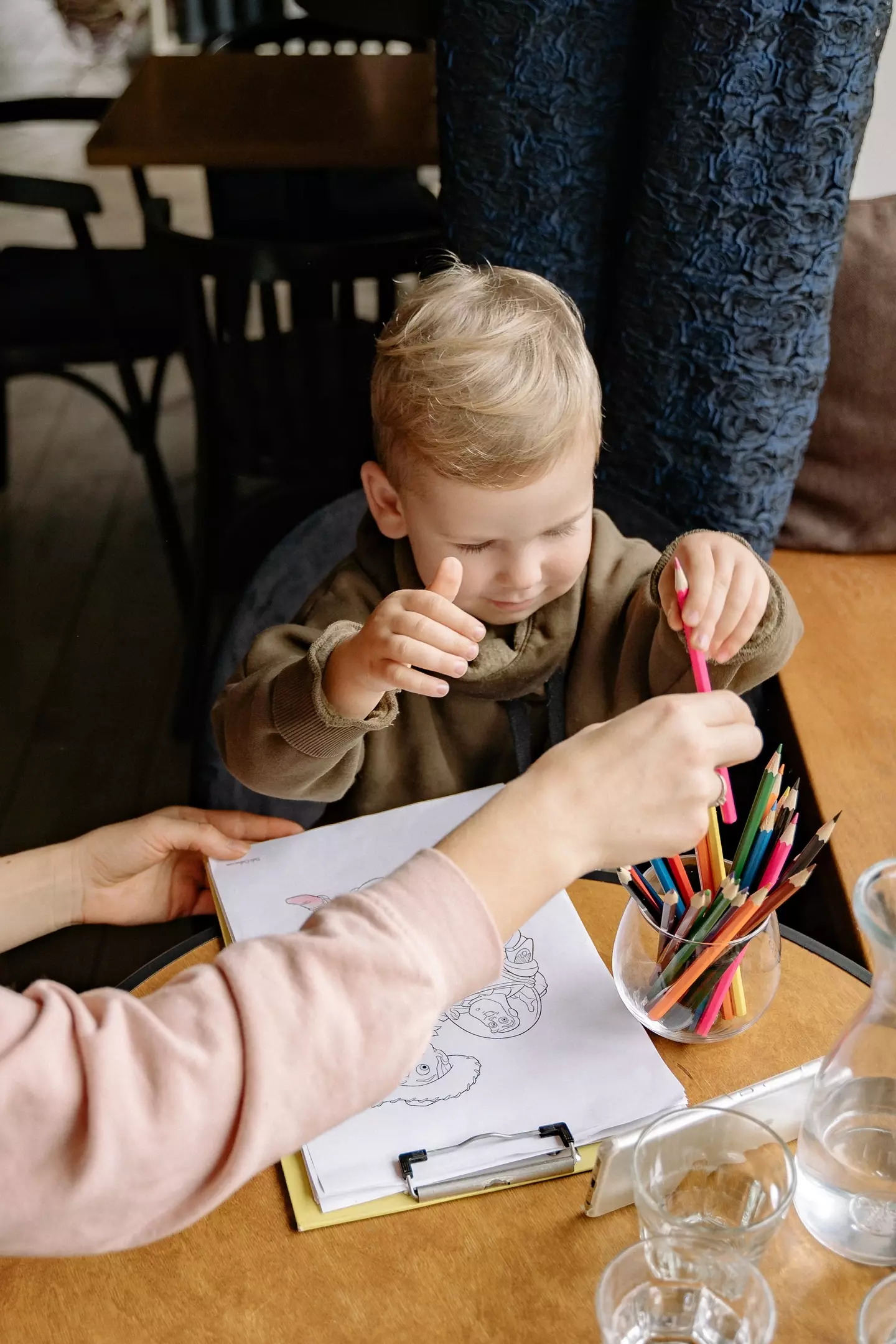 The mum was 'told off' after leaving her son at the table (stock image).