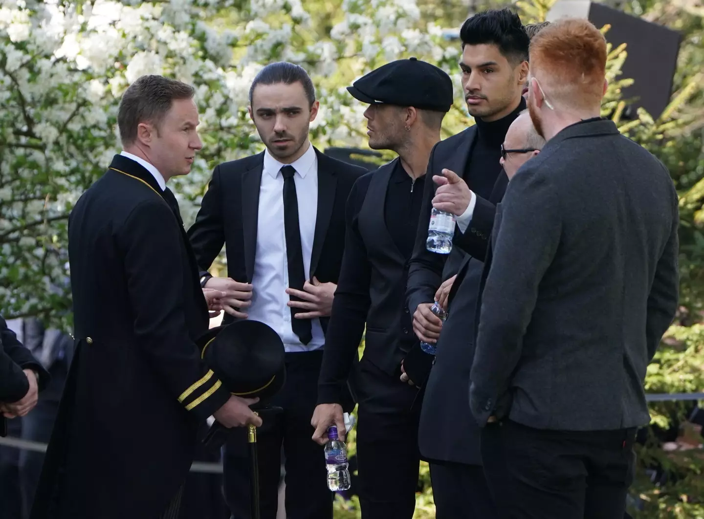 The members of The Wanted Nathan Sykes (second left), Max George (centre) and Siva Kaneswaran (third right) arrive for the funeral of The Wanted star Tom Parker (