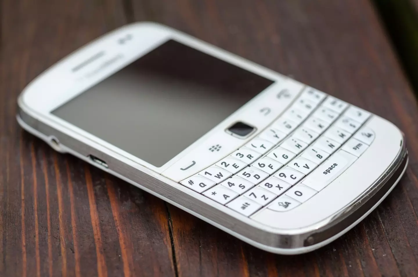 A white BlackBerry Bold model (