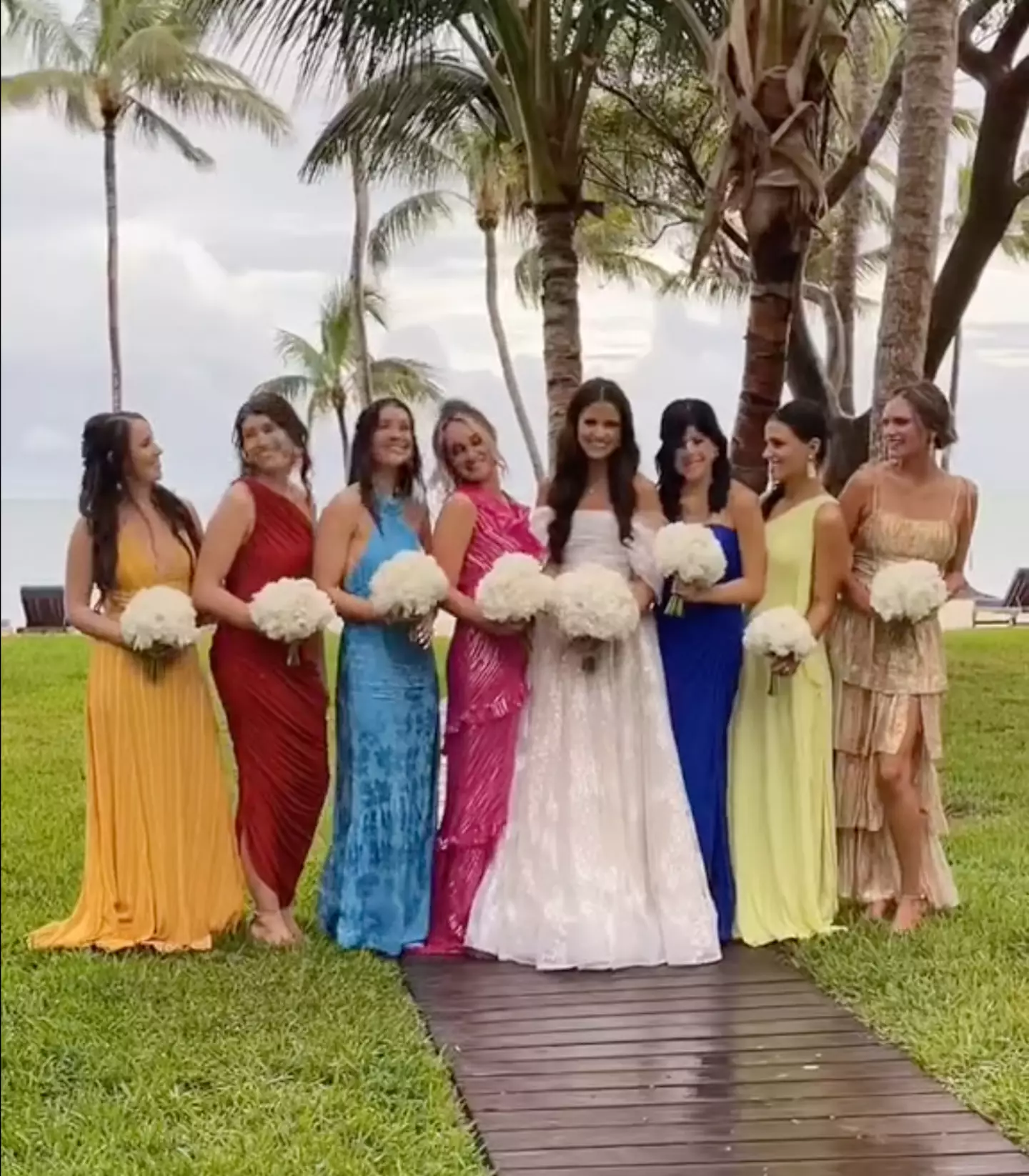 The bridesmaids all wore different dresses.
