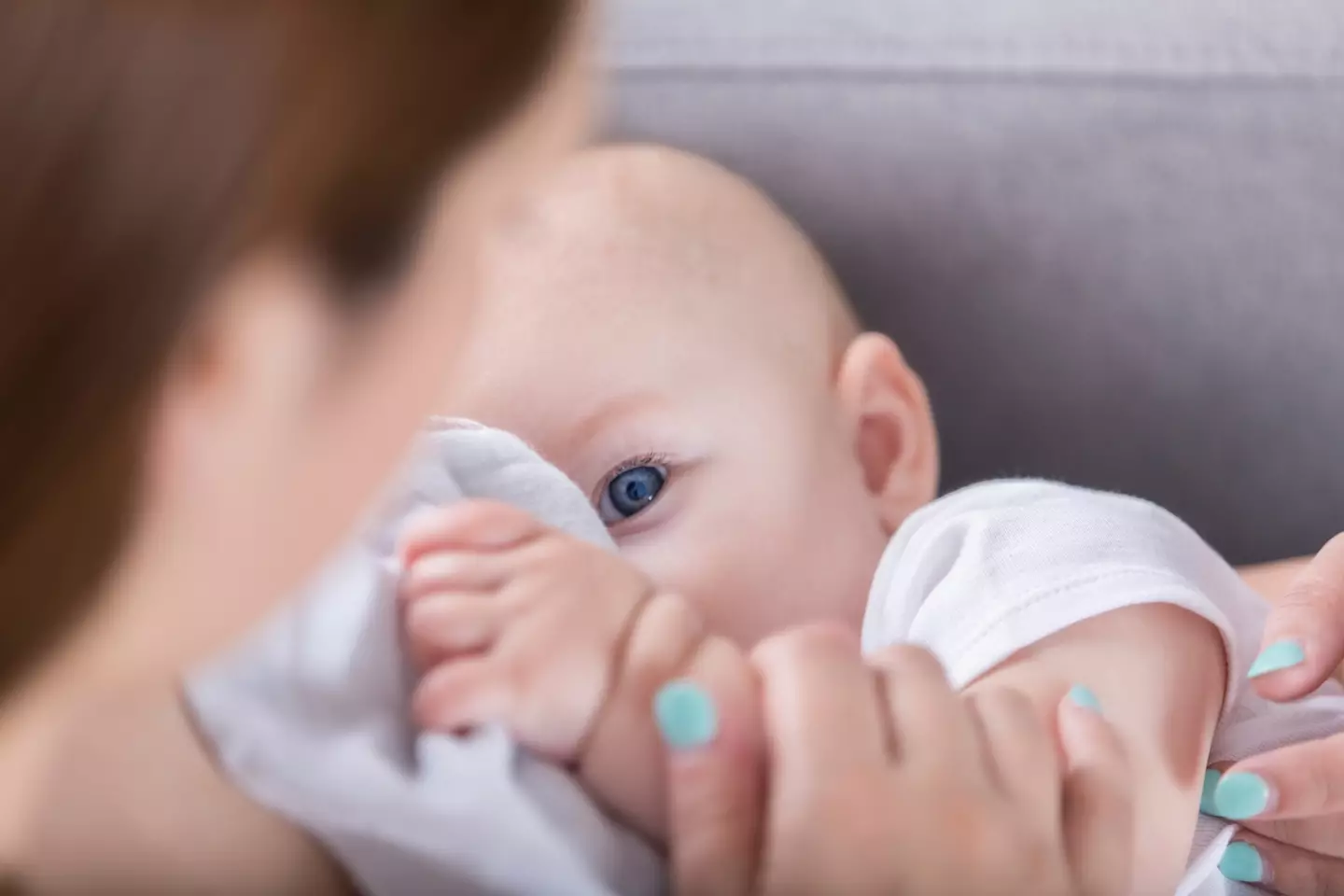 The mum claimed a flight attendant told her to 'cover up' while breastfeeding her five-month-old on a flight.