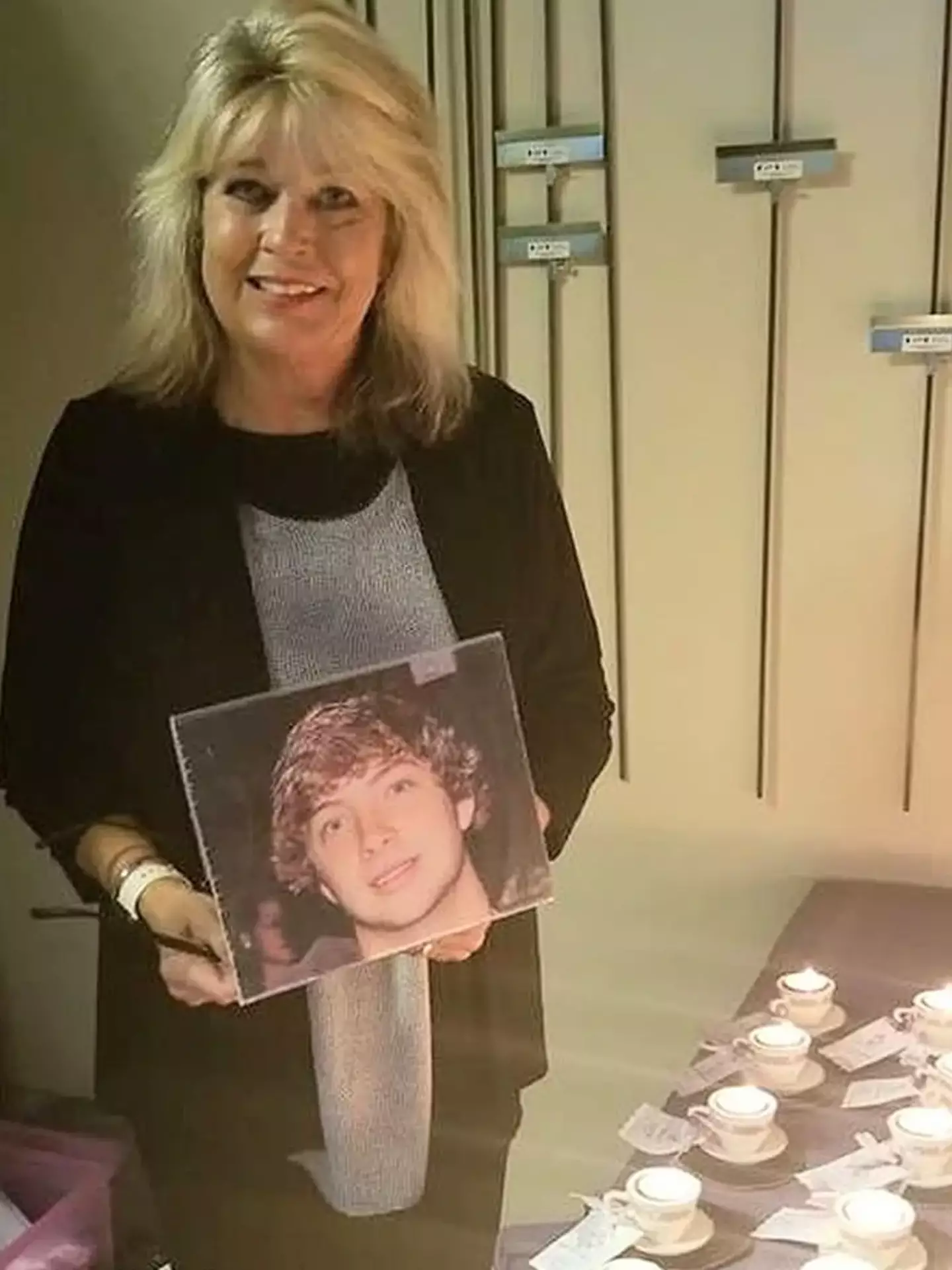 Ms Hodge pictured with a shrine to her late son Robbie.