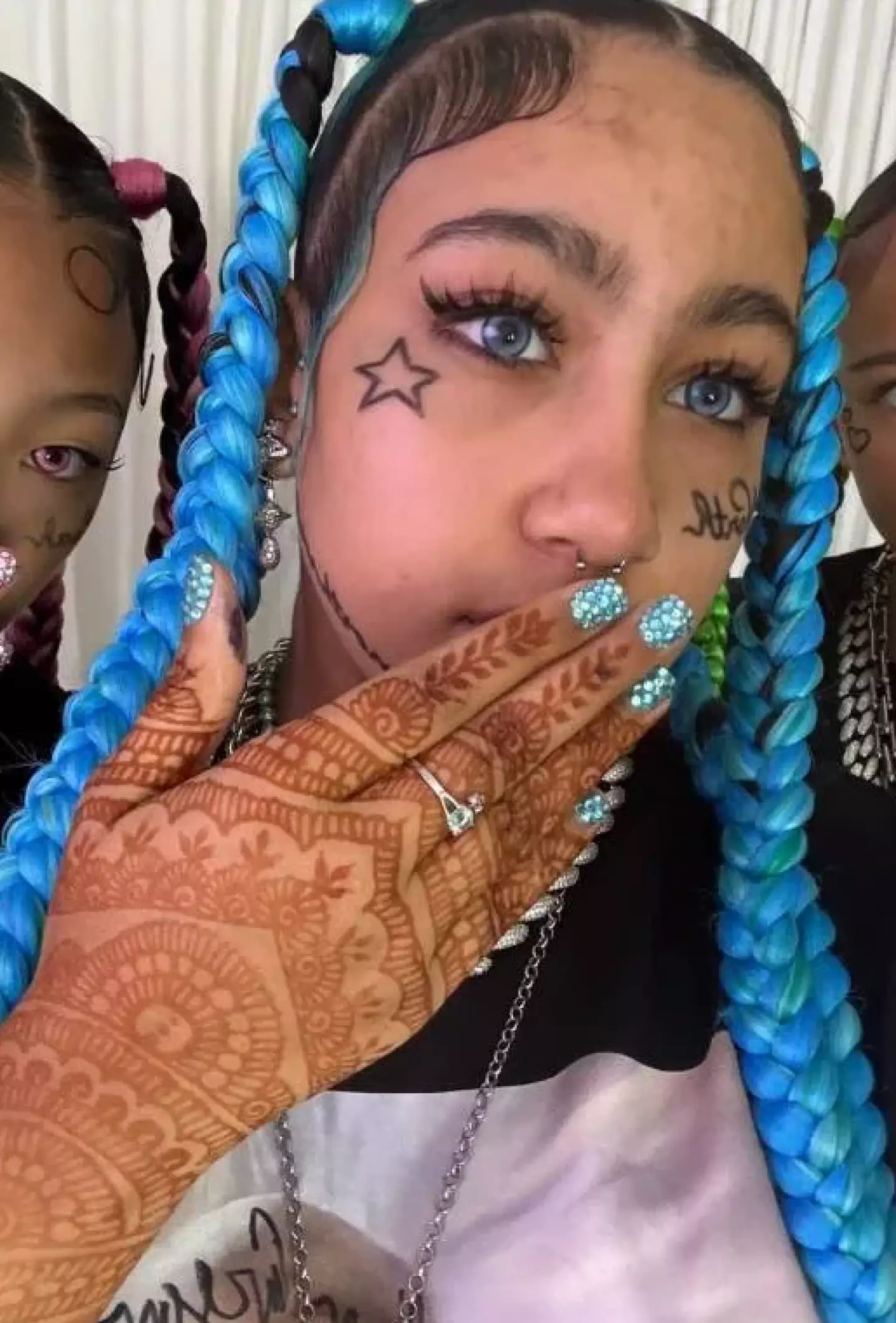 The youngster donned fake face tattoos and piercings (TikTok/@kimandnorth)