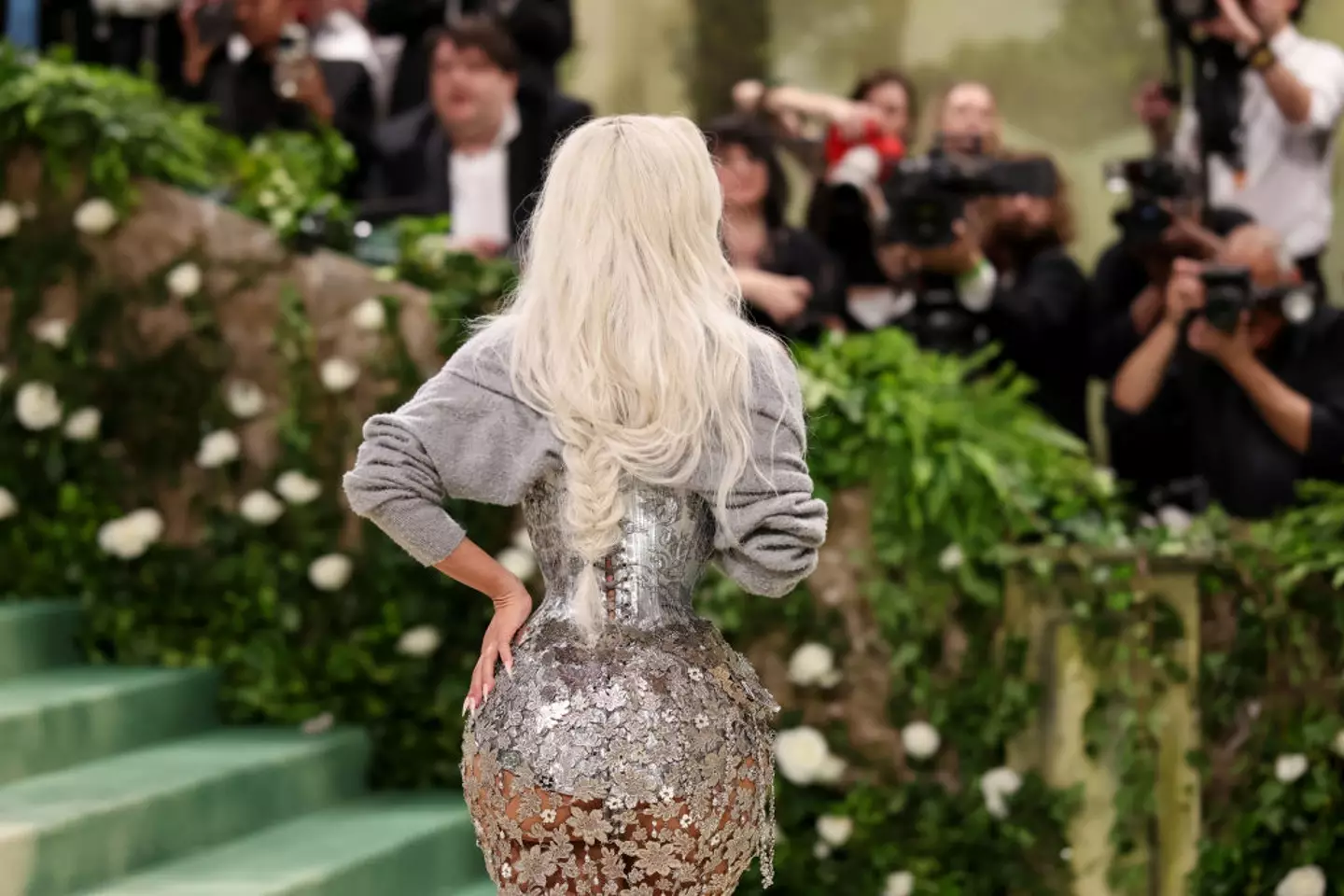 Kim paired a grey cardi with her dress, which also confused viewers (John Shearer/WireImage)