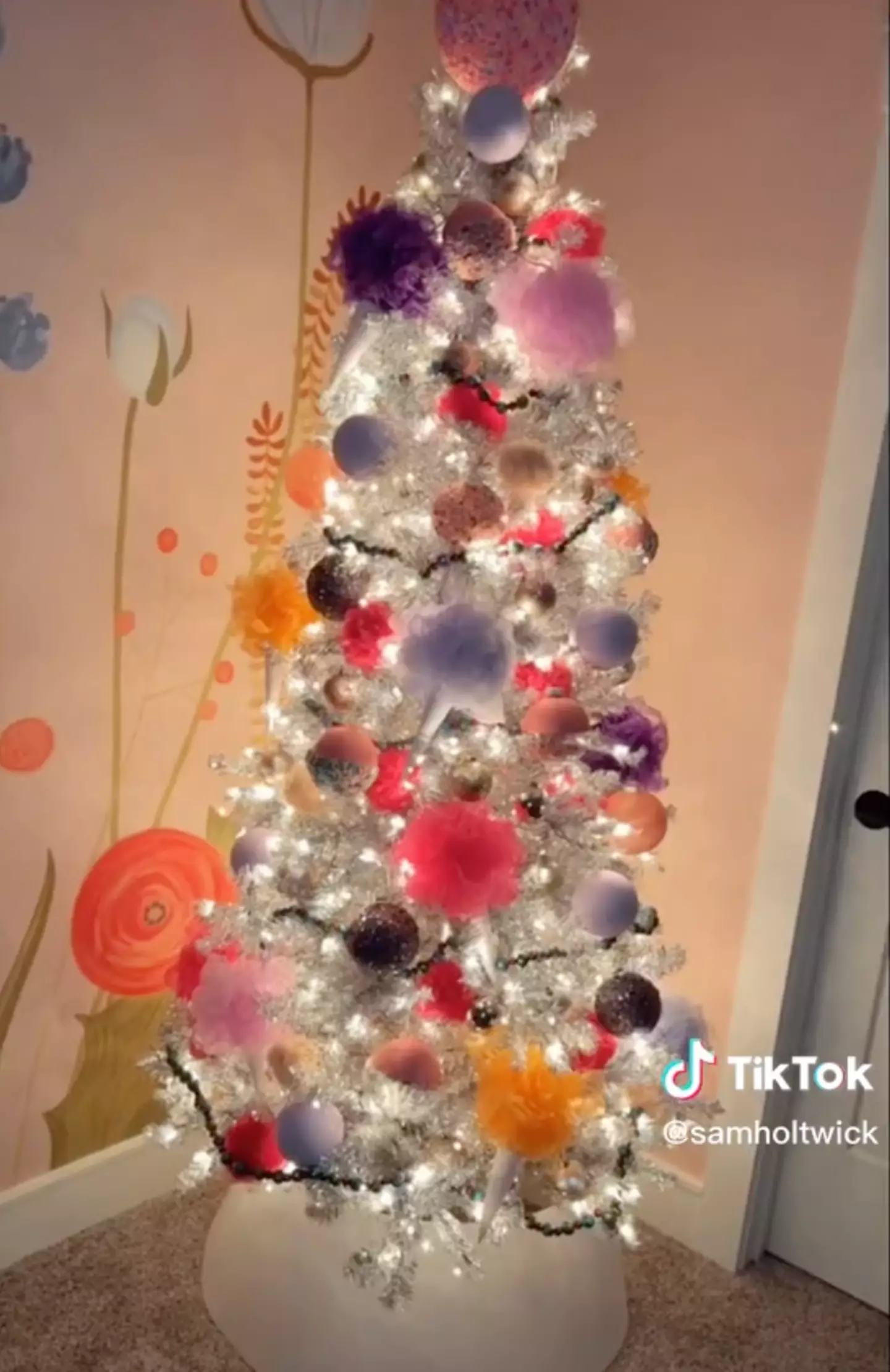 Sam made a candy-themed Christmas tree using shower loofas.