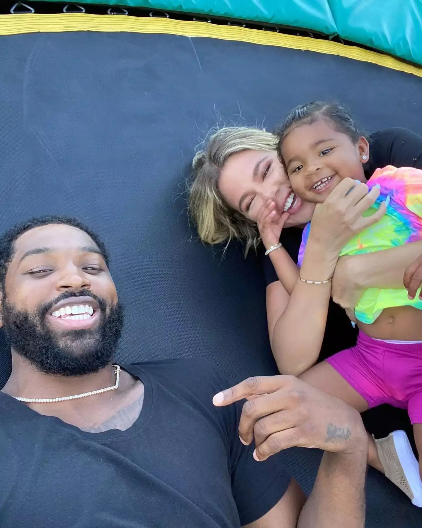 Khloé and Tristan and their daughter True.