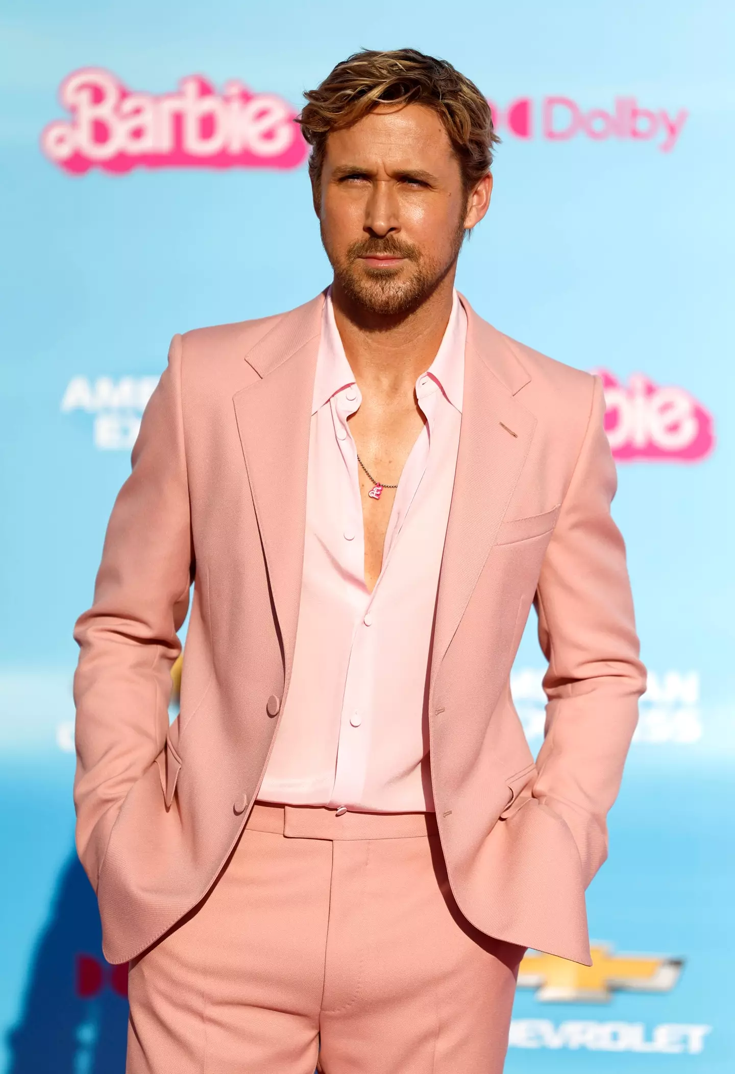 Gosling wore a pink Gucci suit and chain necklace.
