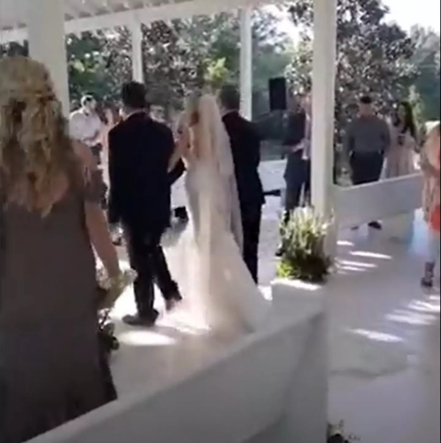 Both men walked the bride down the aisle at her wedding.