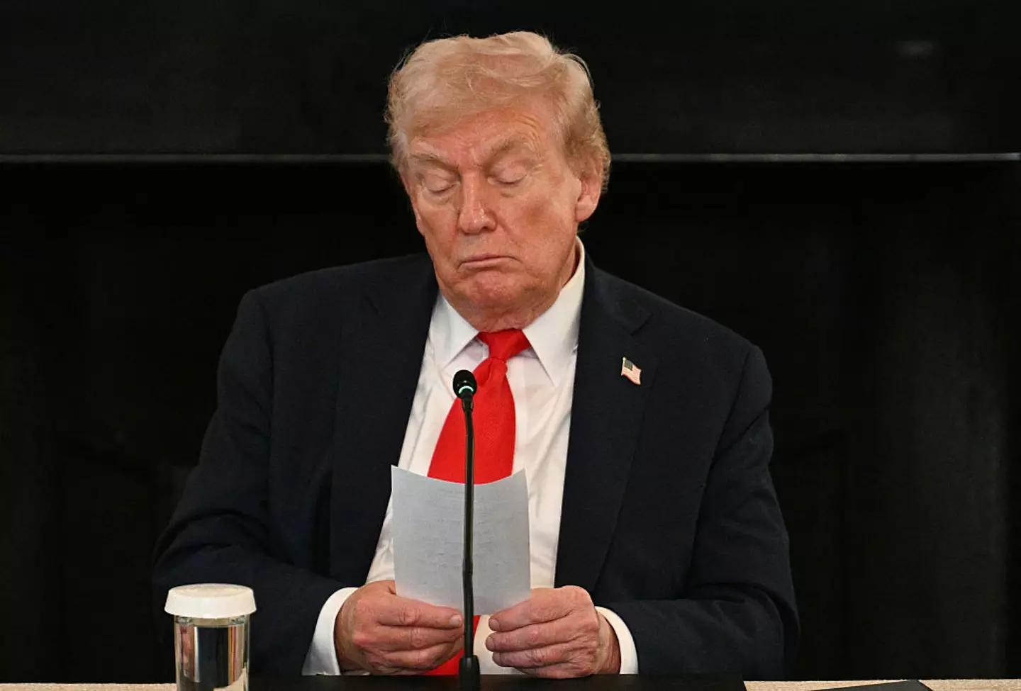 Trump got handed an elusive handwritten note during a press conference yesterday (JIM WATSON/Getty Images)