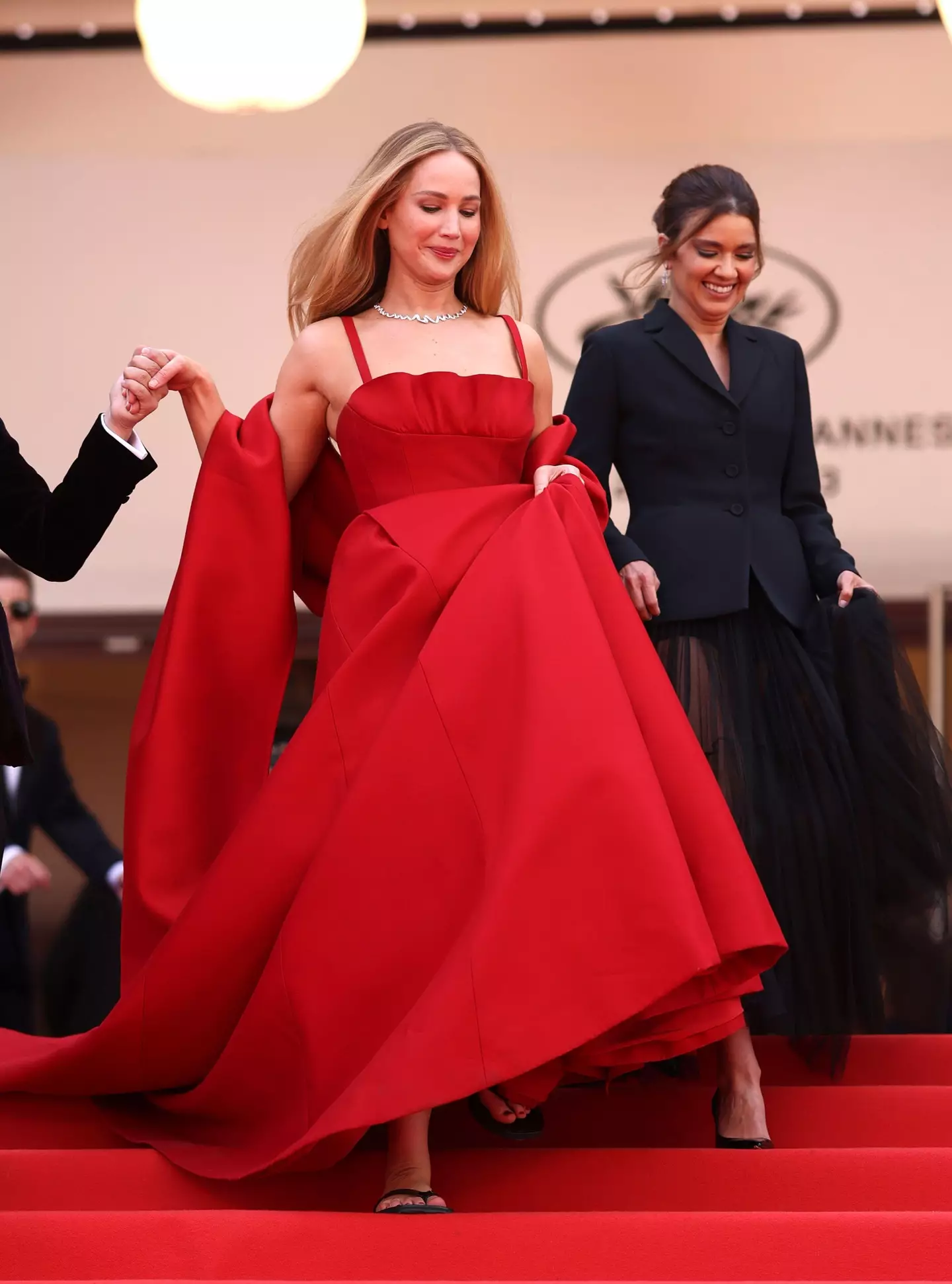 Lawrence paired her Christian Dior gown with... flip flops.