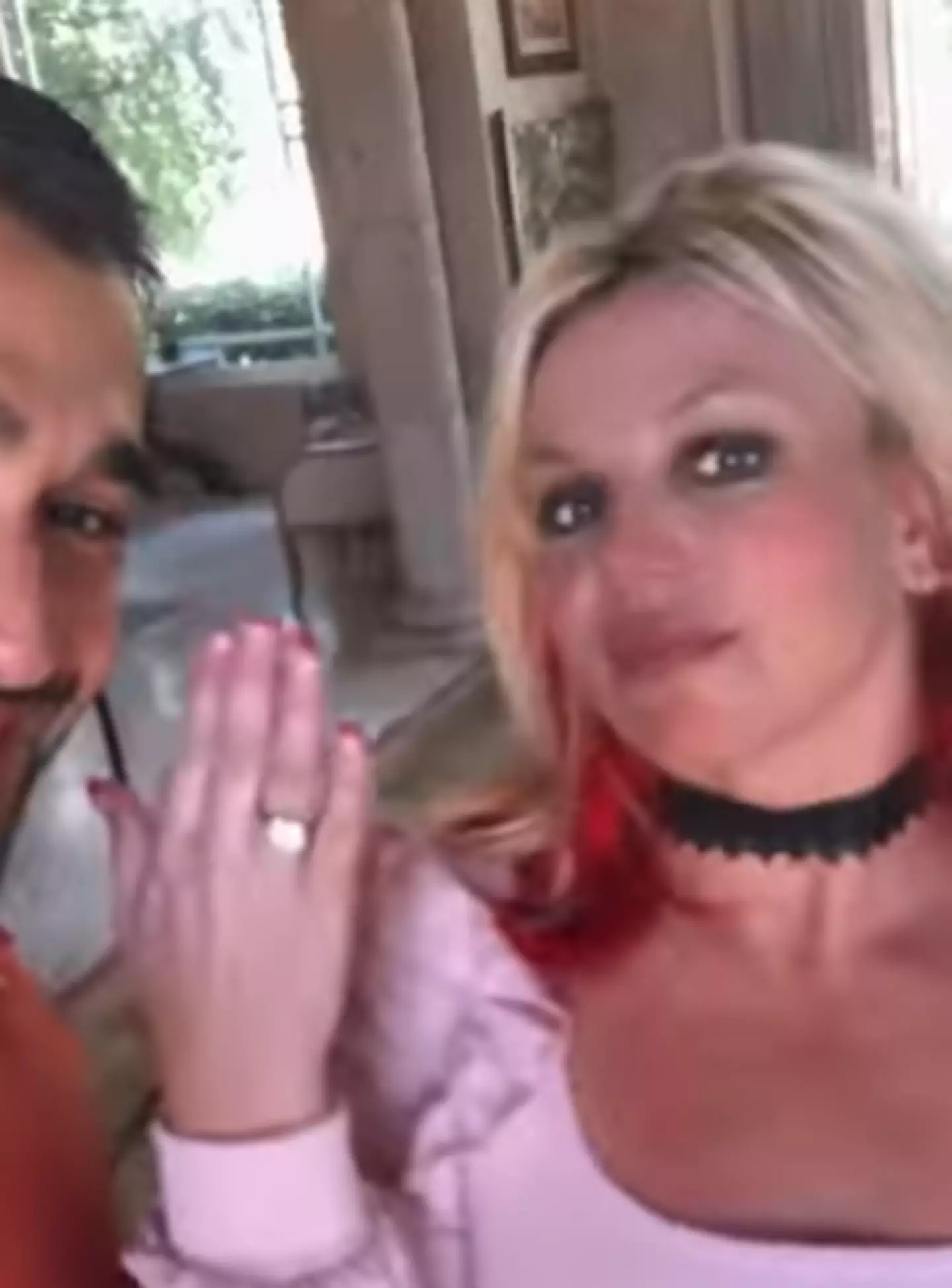 Britney had red streaks in her hair in her engagement video (