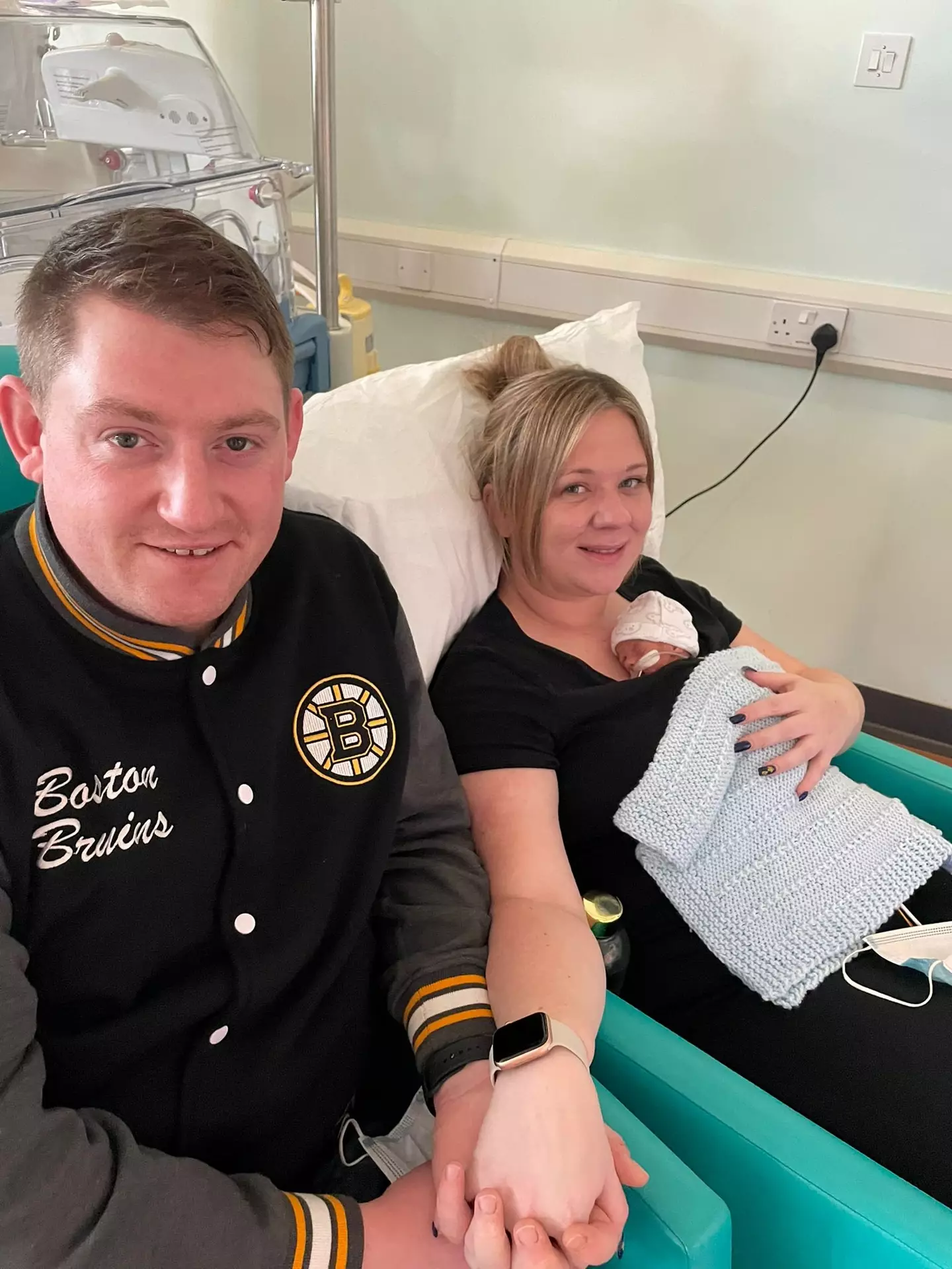 Chloe and husband Nicholas in hospital where they spent weeks before George was allowed to go home with them.