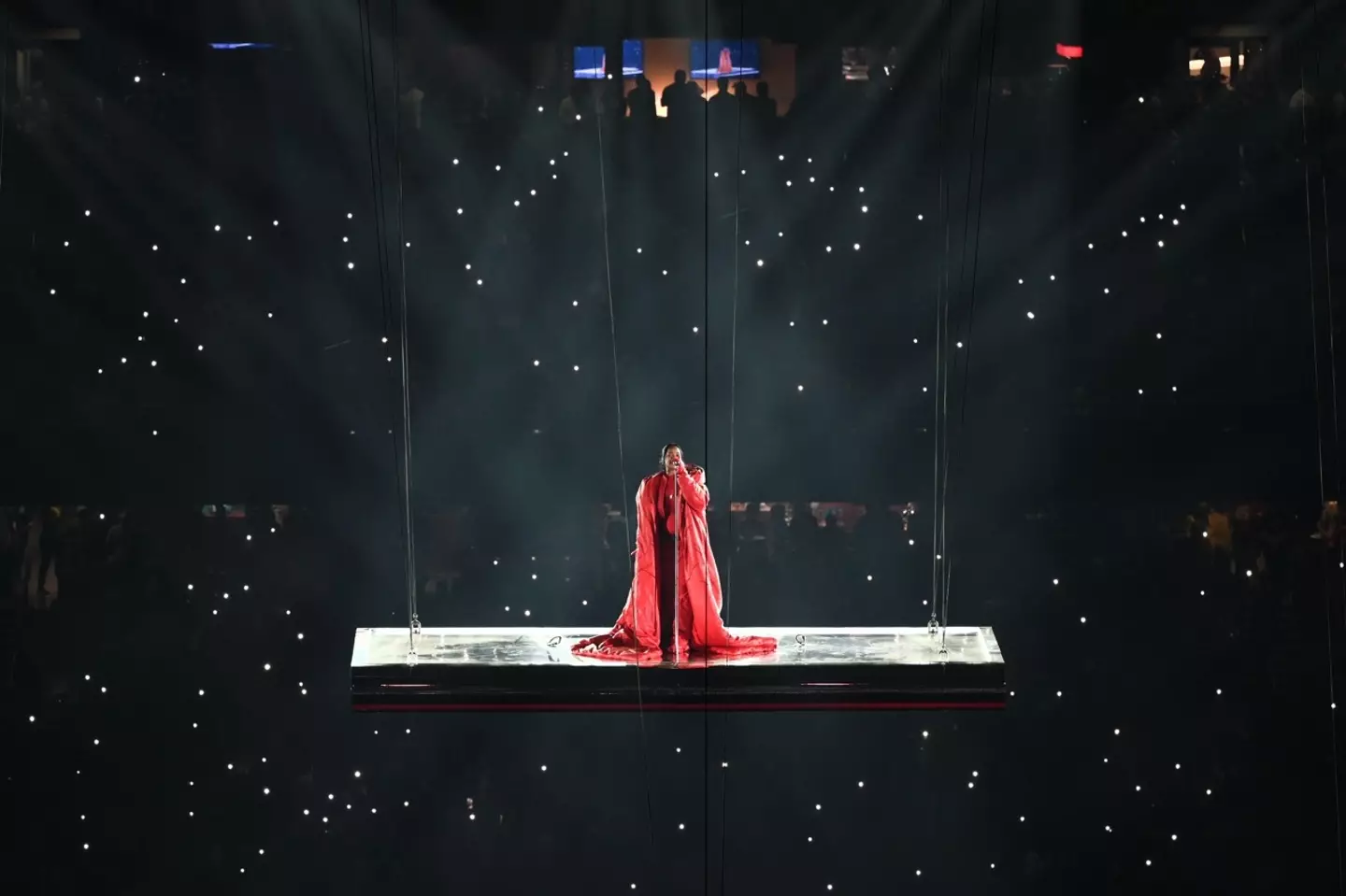 The singer kicked off her live performance suspended high above the Arizona stadium on Sunday (12 February).
