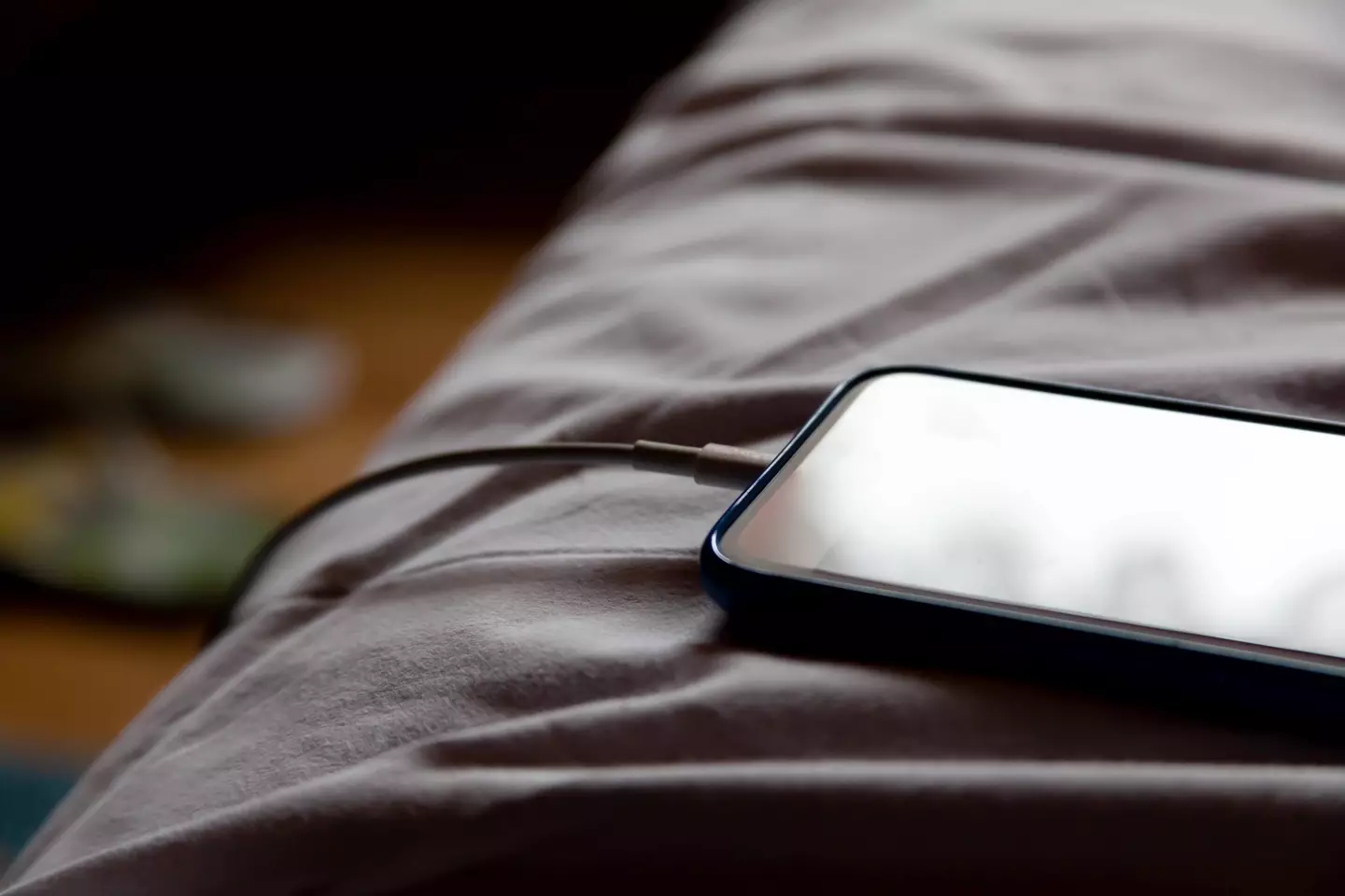 Are you guilty of leaving your phone charging as you sleep? (Tomasz Śmigla/Getty Images)