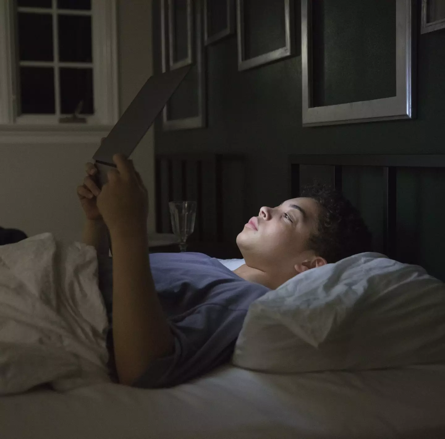 Electronics could stop you from snoozing all night. (Filmstax/Getty images)